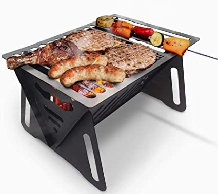Portable charcoal grill with assorted meats and vegetable skewers