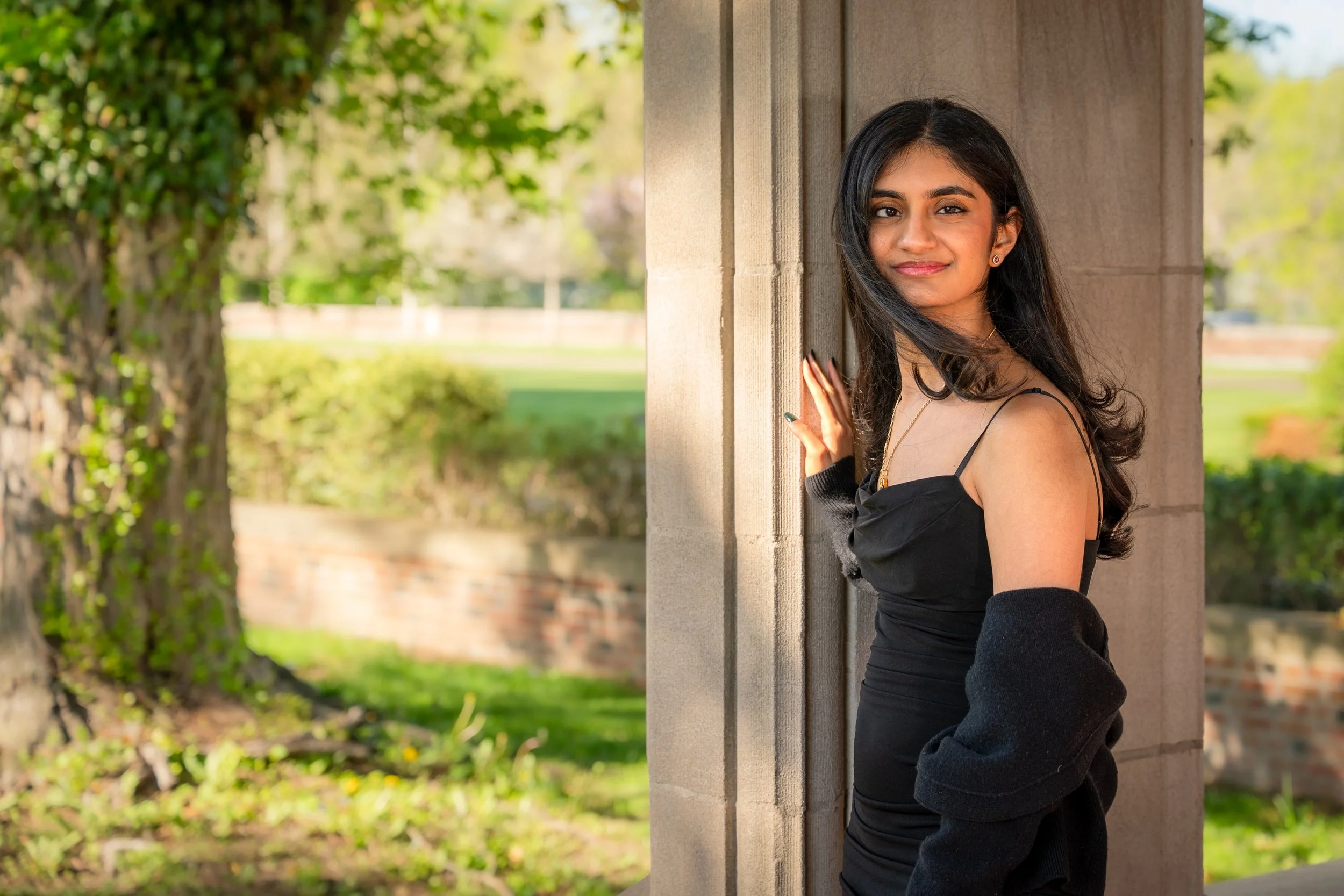 Young woman with long black hair in black dress