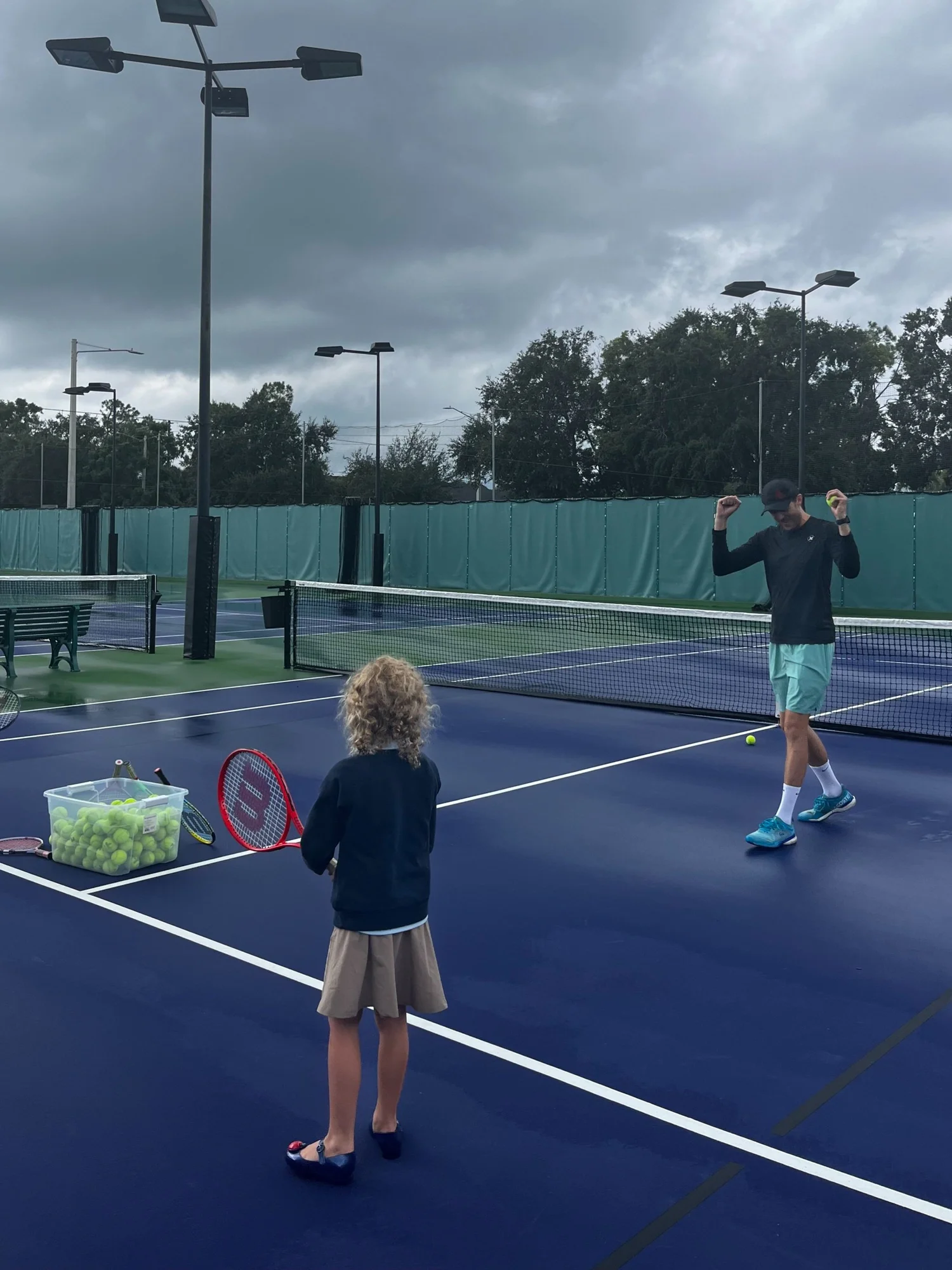 A tennis lesson in action at Shalom Orlando