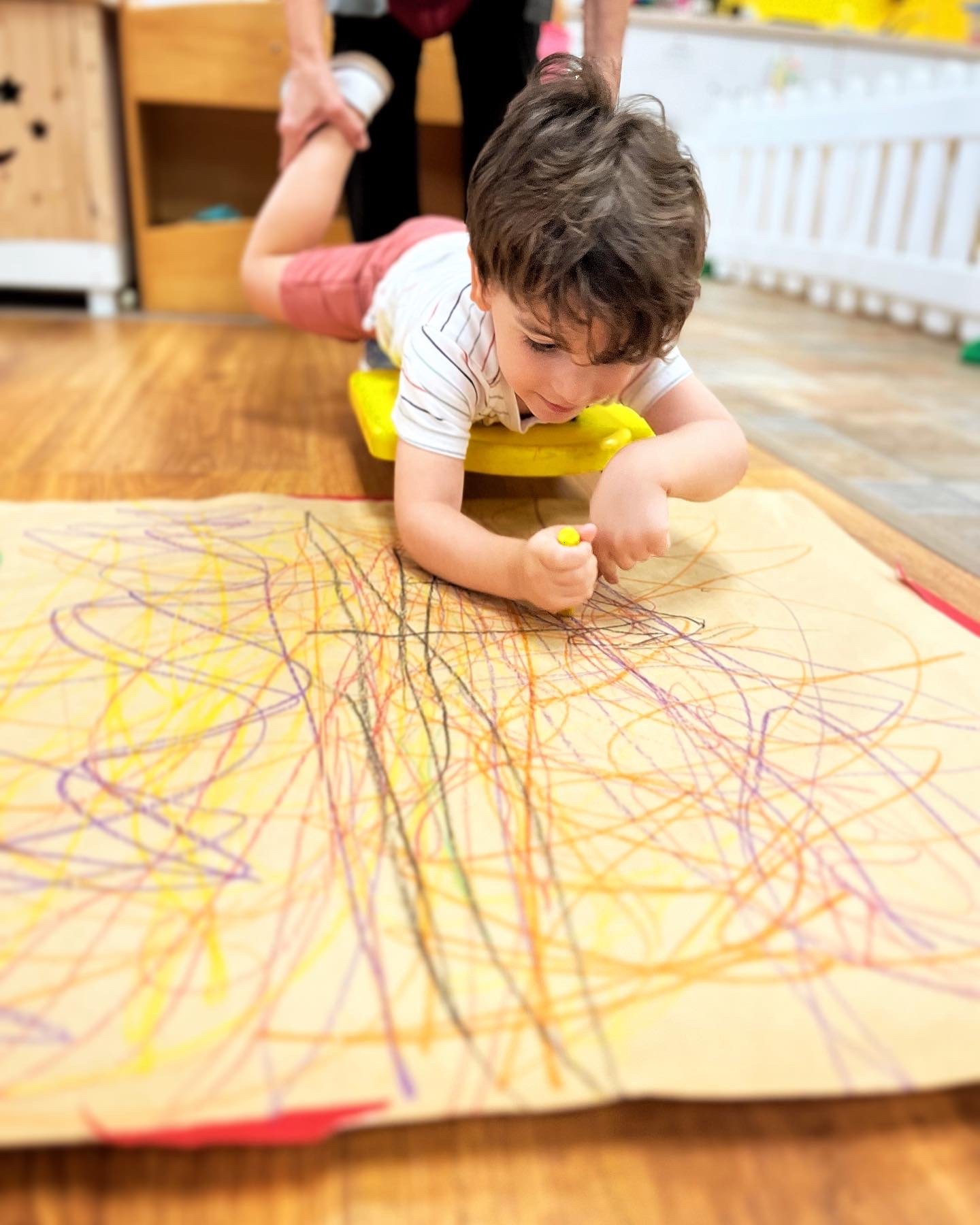 A young child drawing at ECLC