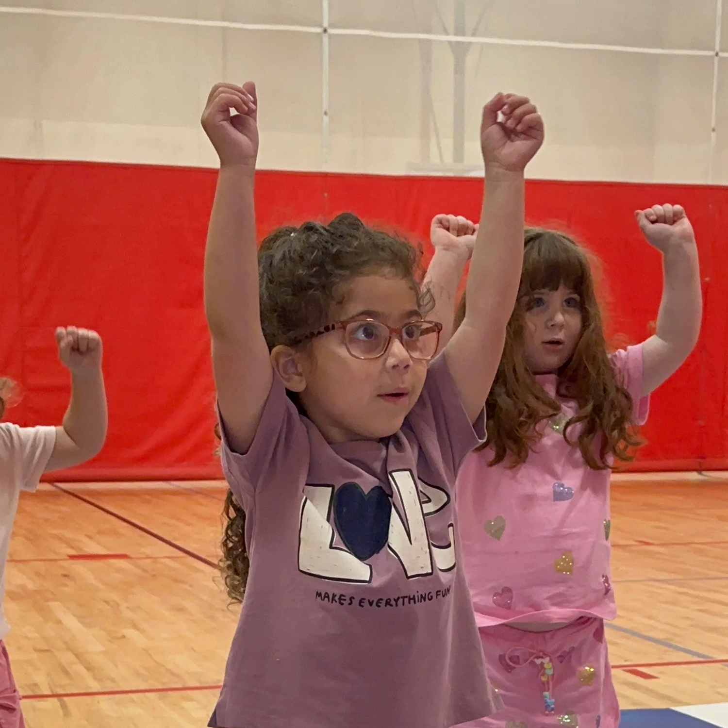 Young children in a cheer and movement class at Shalom Orlando