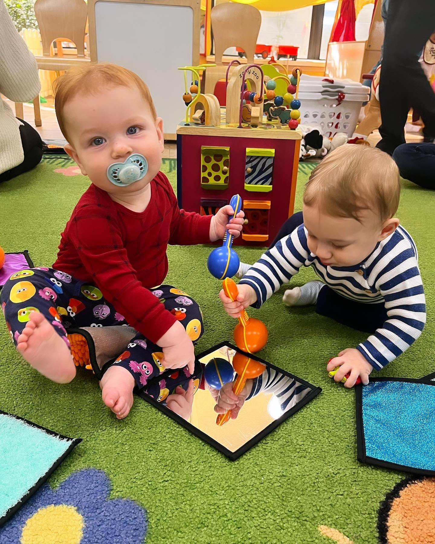 Babies playing with sensory toys at ECLC