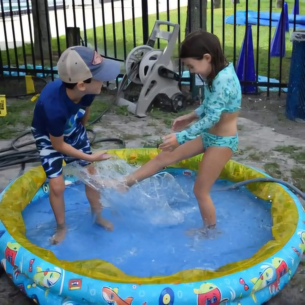 Young children playing in the water at Shalom Orlando