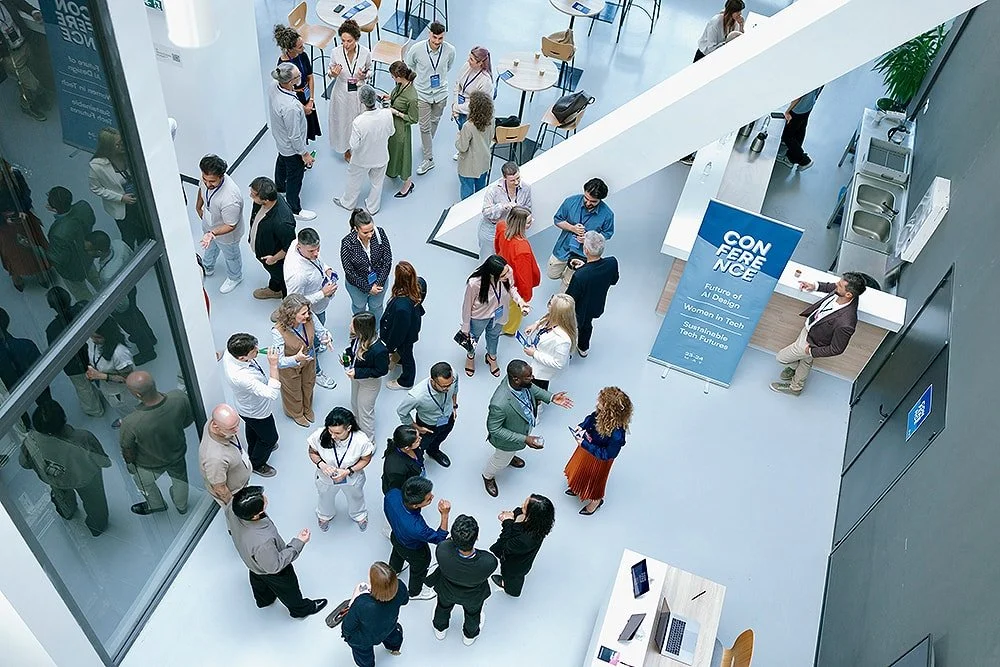 Crowd of industry professionals at a conference.