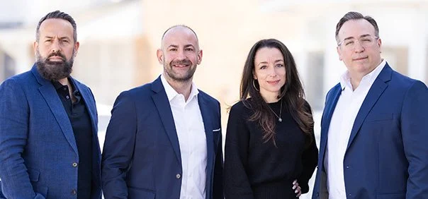 Four Elevate advisors pose for photo