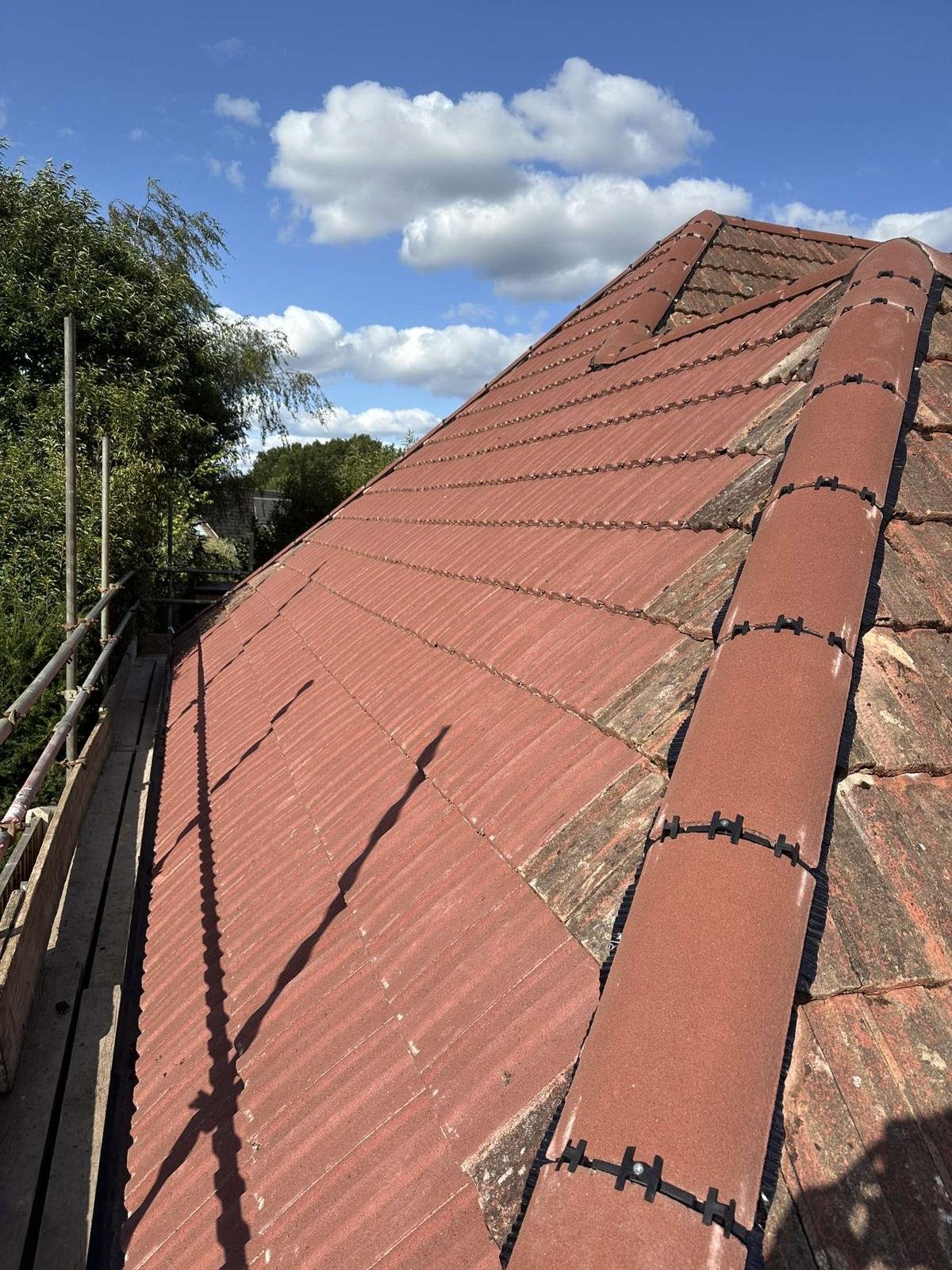 New ridge tiles installed for a secure, weatherproof finish.