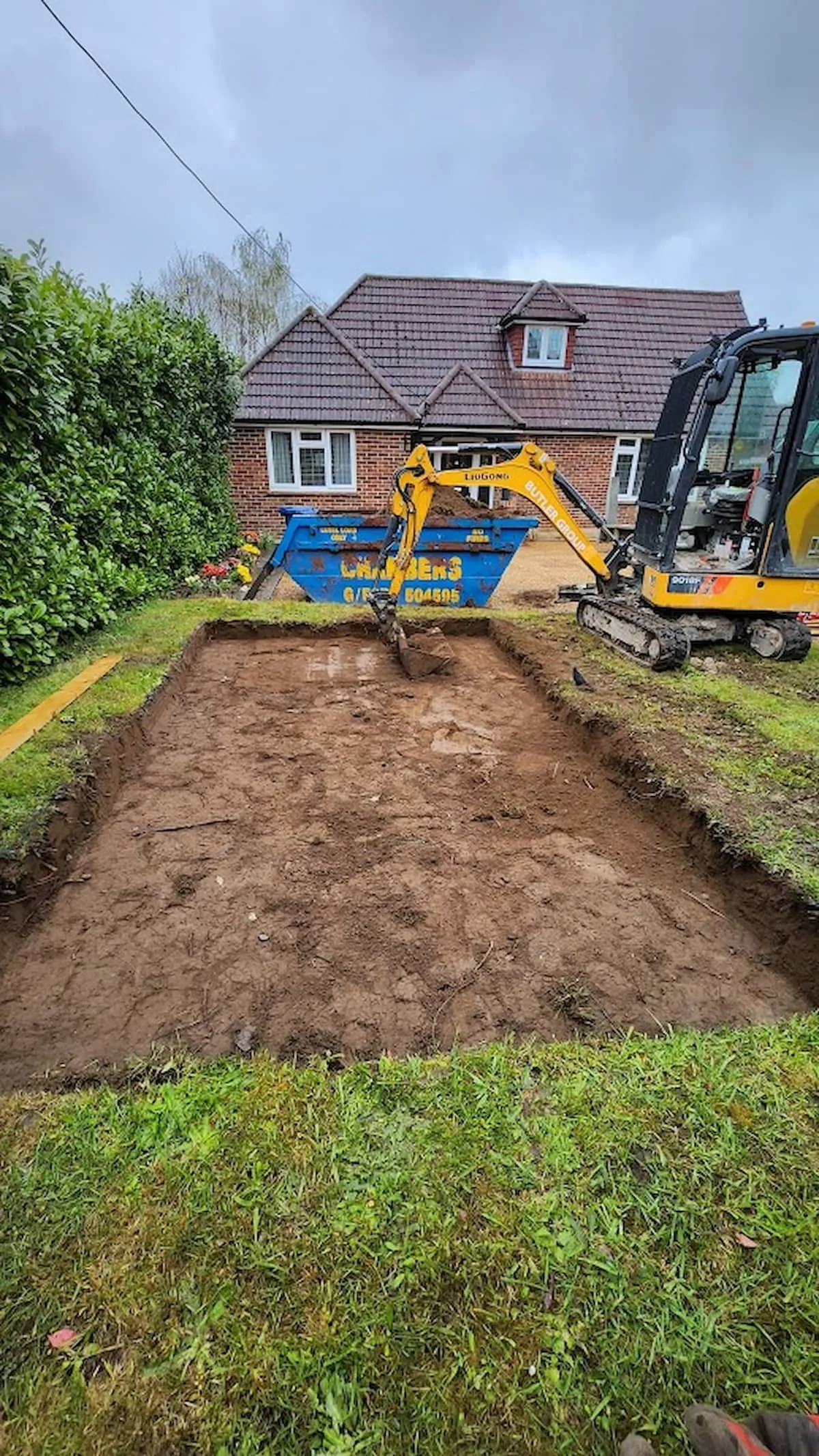 Excavation extended to create a fully level area for the concrete shed base.