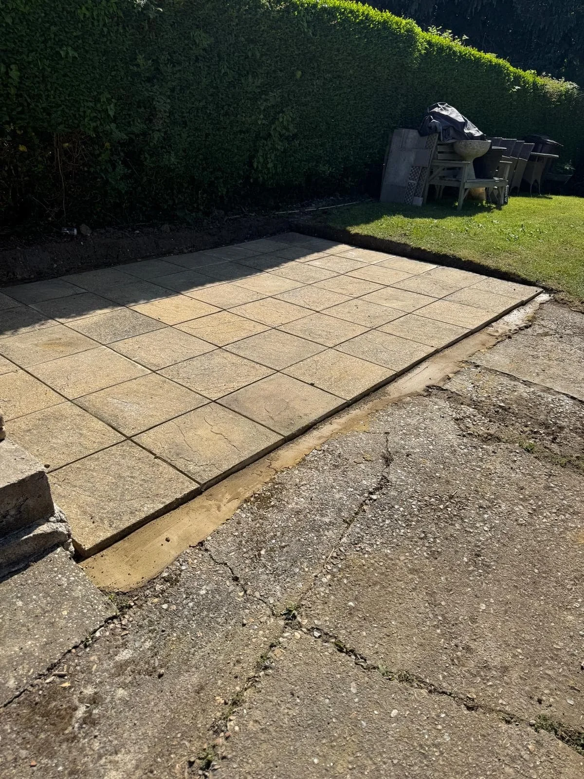 New patio fully installed using the customer’s existing slabs, creating a clean and practical outdoor space.