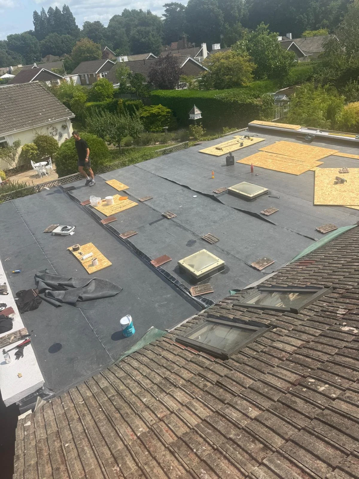 Final membrane sections installed neatly across the flat roof area.