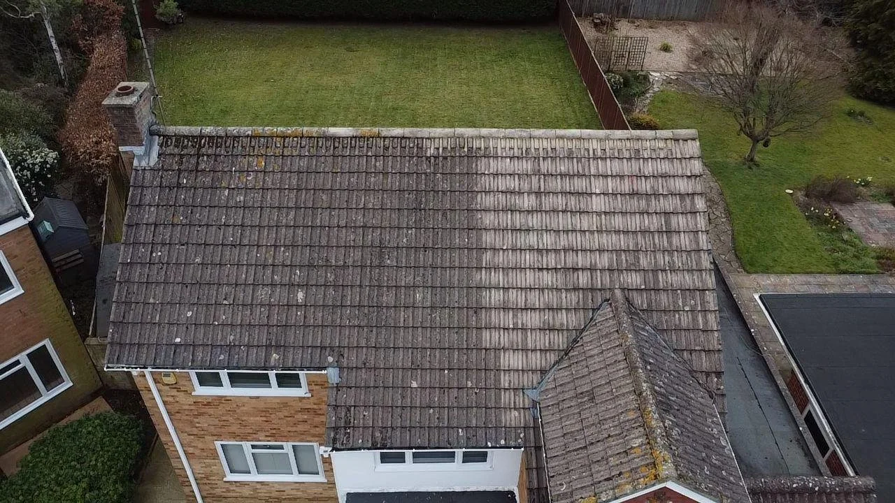 Drone view showing strong contrast between cleaned tiles and untreated areas.