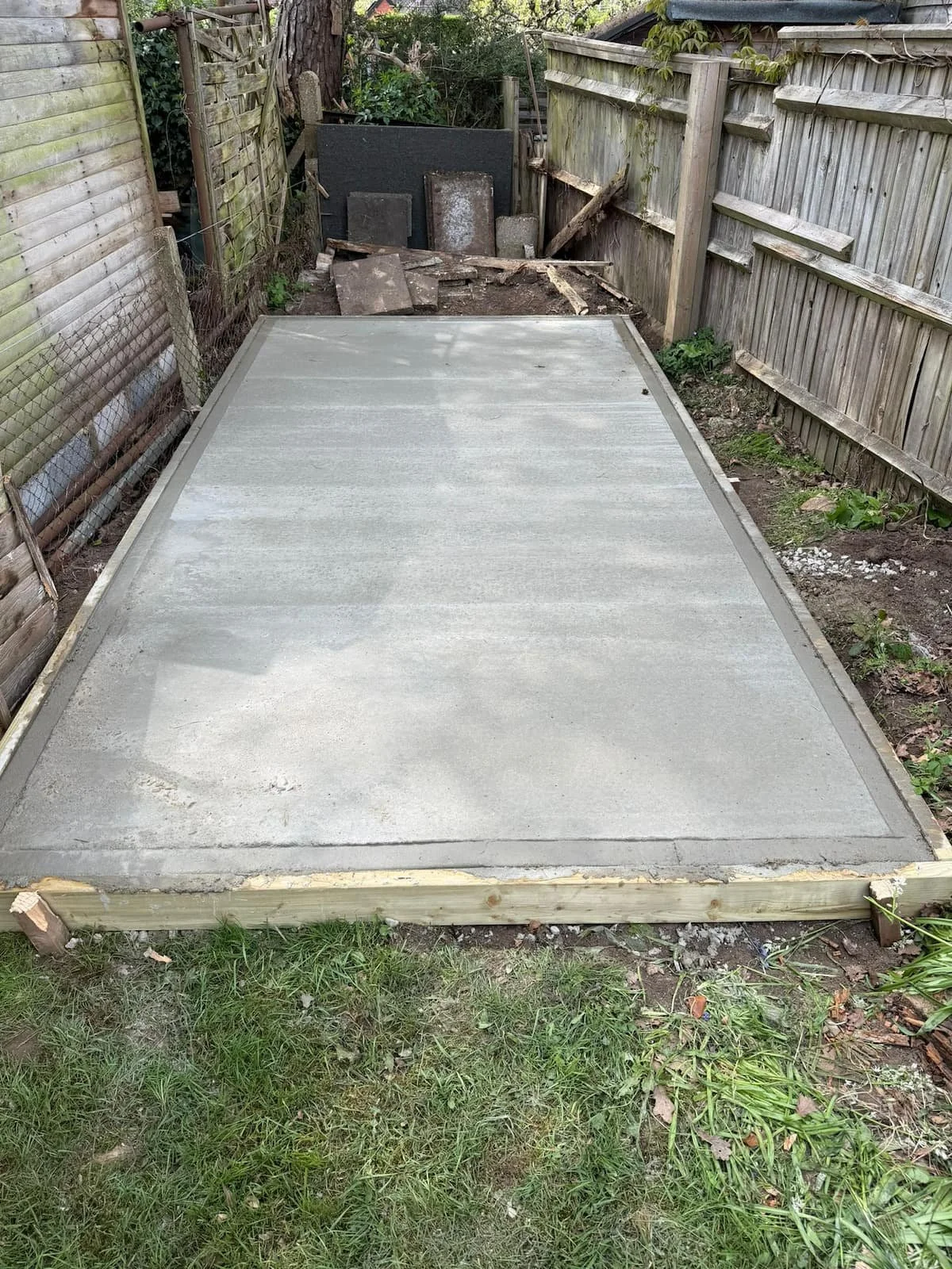 Finished concrete base installation, providing a strong, level and durable foundation ready for a garden building.