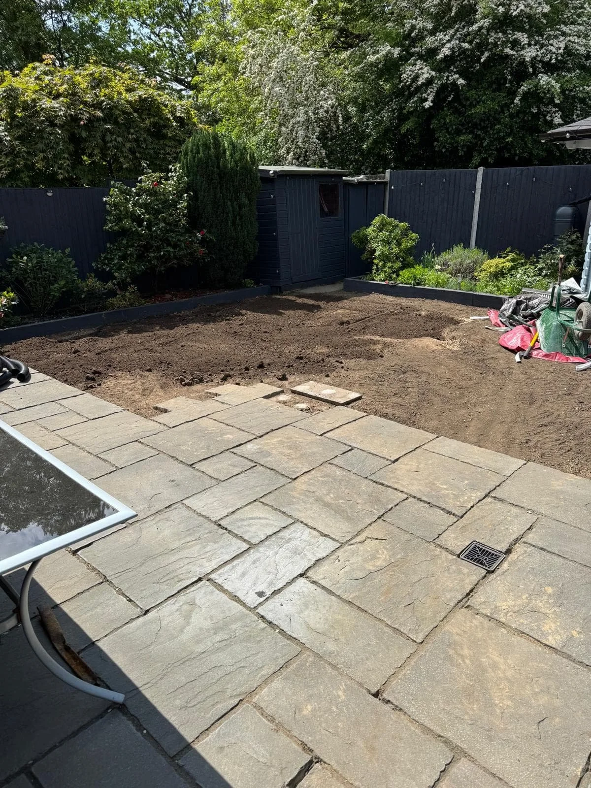 Soil replaced and levelled after soakaway installation, ready for topsoil and turf.