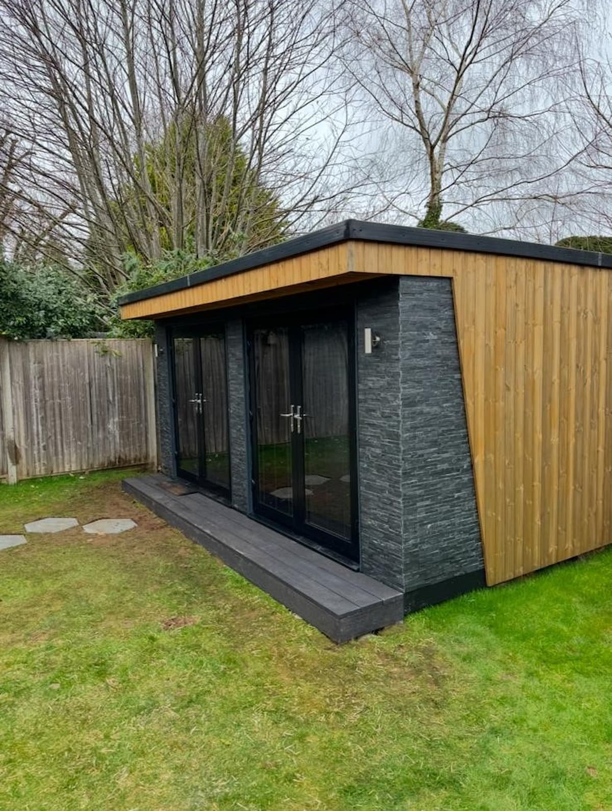 Composite decking step installed before timber cladding treatment.