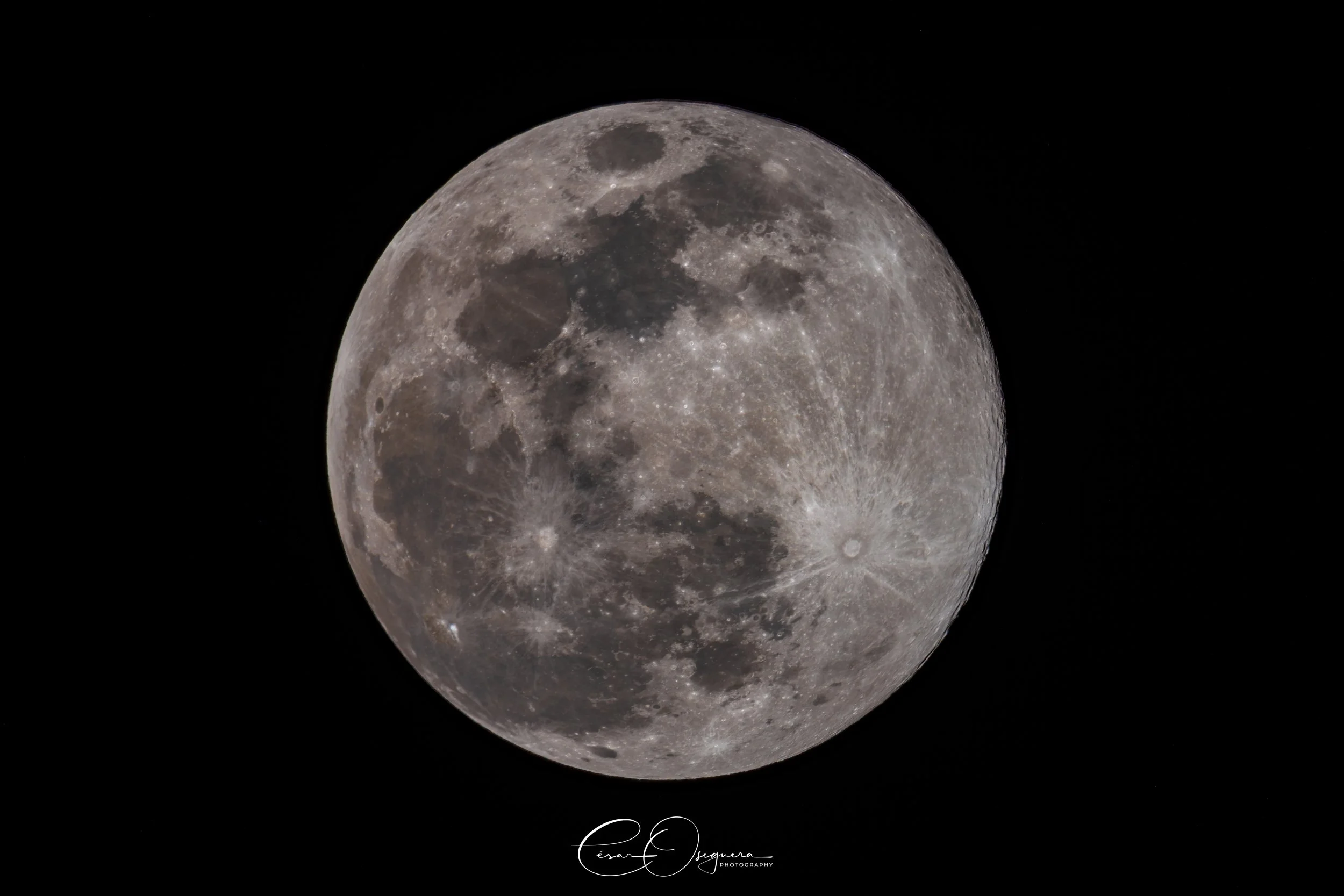 Close-up image of the full moon against a black night sky.