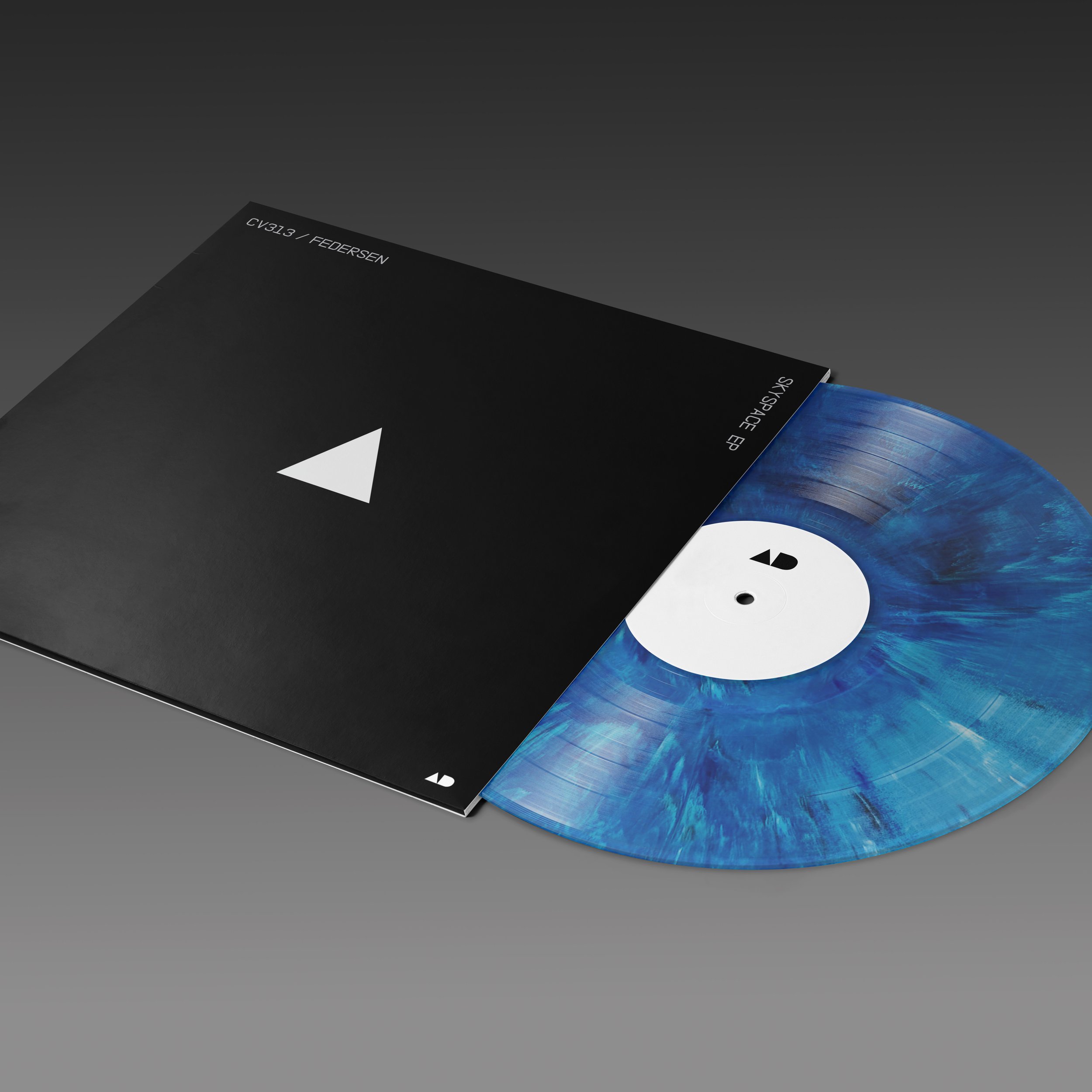 A vinyl record partially pulled out from a black sleeve with a minimalist white triangle logo and text, featuring a marbled blue design on the record with a white label.