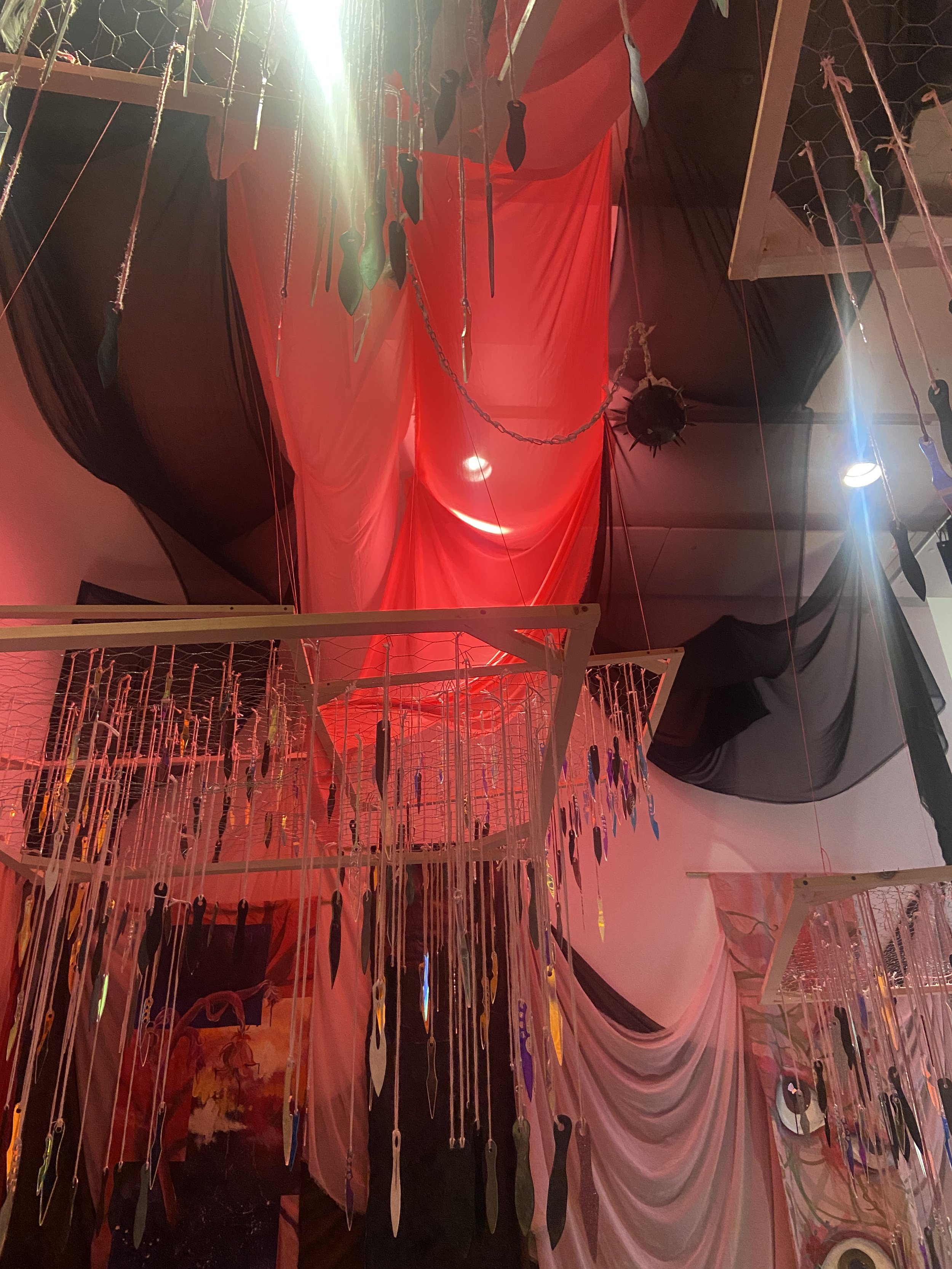 Cynthia Nathan, The Space That Holds Us: Built from Memory, Fear, and the Hope of Something Softer, 2023-2025; Multimedia Installation: Acrylic Paint on Muslin, Spray Paint, Glitter, Glitter Glue, Gold Leaf, Silver Leaf, Liquid Gold Leaf, Broken Mirr