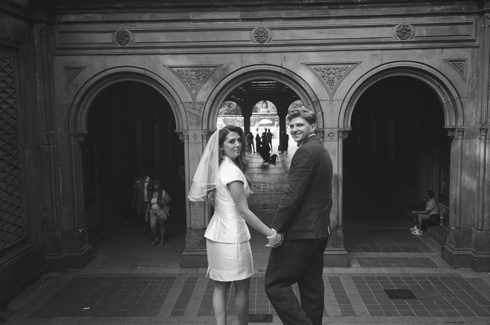 Newly married couple beneath the arches at New York City Hall