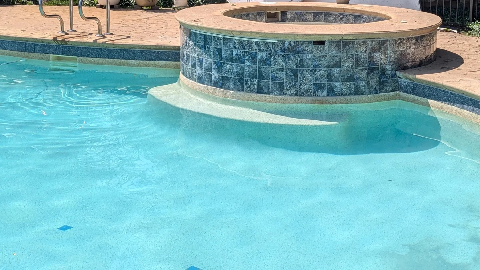 Residential swimming pool with custom tile installation in Illinois