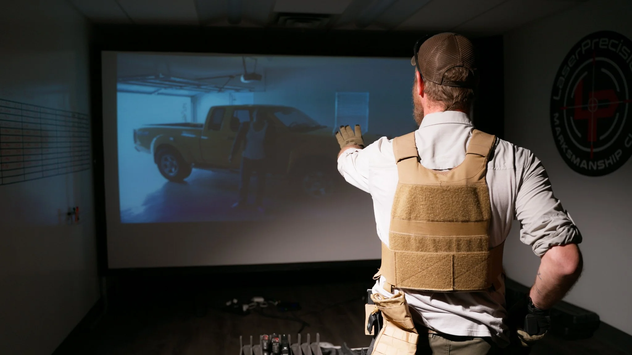 Man participating in a tactical training scenario using the shooting simulator at LPMC