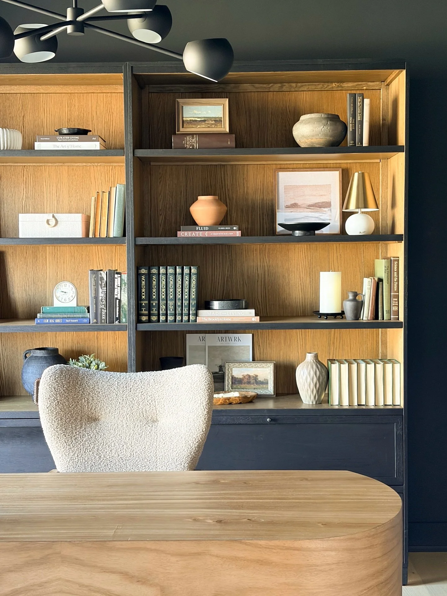 After nine long months, the bookcases have finally arrived&mdash;and they were absolutely worth the wait. Seeing them installed and styling them is incredibly rewarding. They create the perfect backdrop for the stunning desk and truly anchor the enti