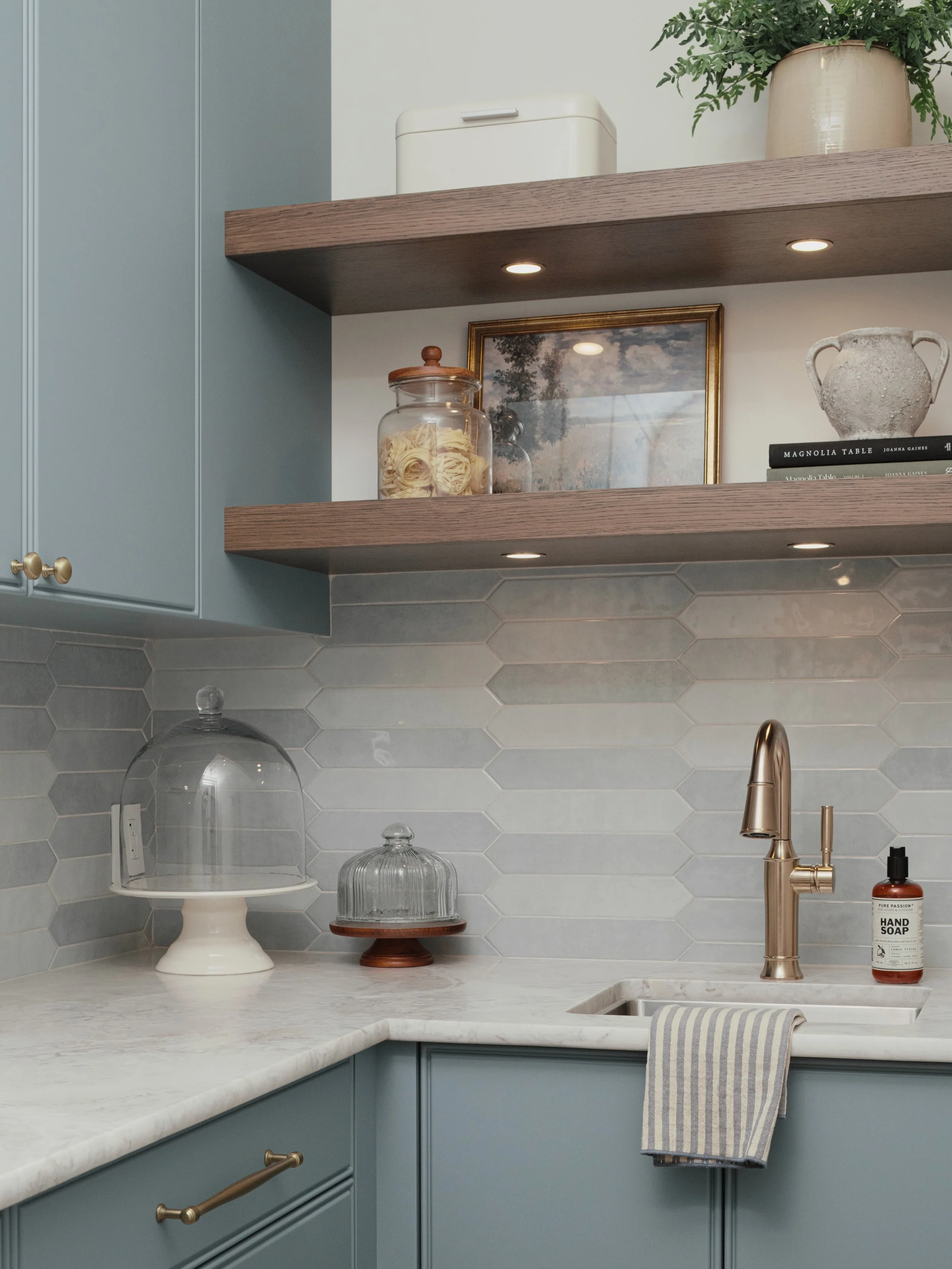 Proof that a hardworking space can still be beautiful. 🤍
This butler&rsquo;s pantry is tucked away, but no detail was overlooked&mdash;from the soft blue cabinetry and warm wood shelves to the brass accents and beautifully imperfect backsplash tile.