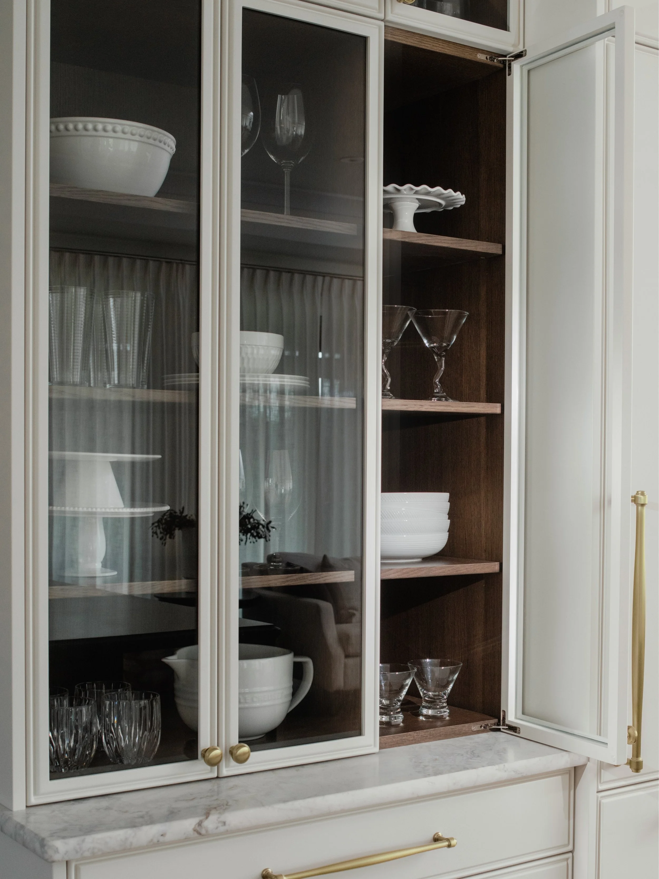 When scrolling, you might think this is just any ordinary cabinet&mdash;but I can confirm, there is nothing ordinary about it.

Everything about this piece was custom: solid oak shelving, a custom stain, custom millwork, even down to the hinges. The 