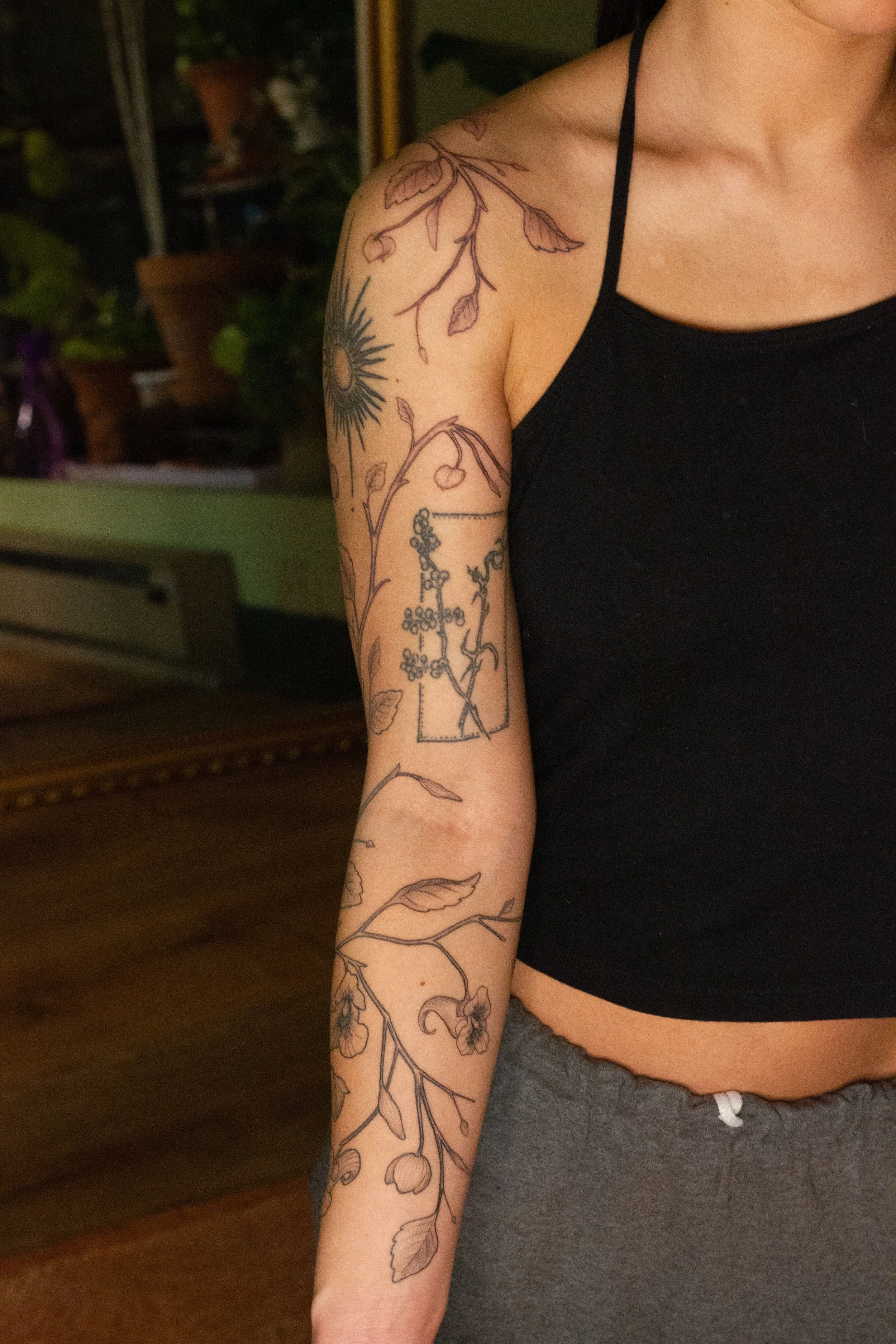 December 2025 · Freehand wrapping Jewelweed, top half of arm is freshly tattooed and bottom half of arm is six days into healing