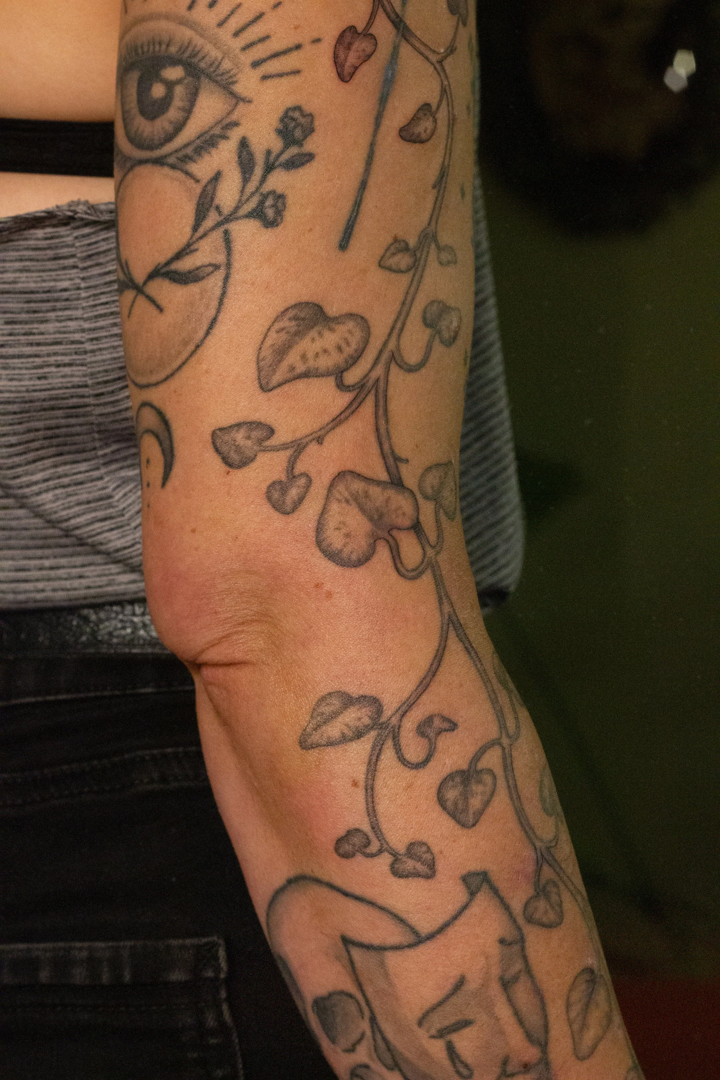 November 2025 · Freehand string of hearts in progress, elbow healed with some touch-ups