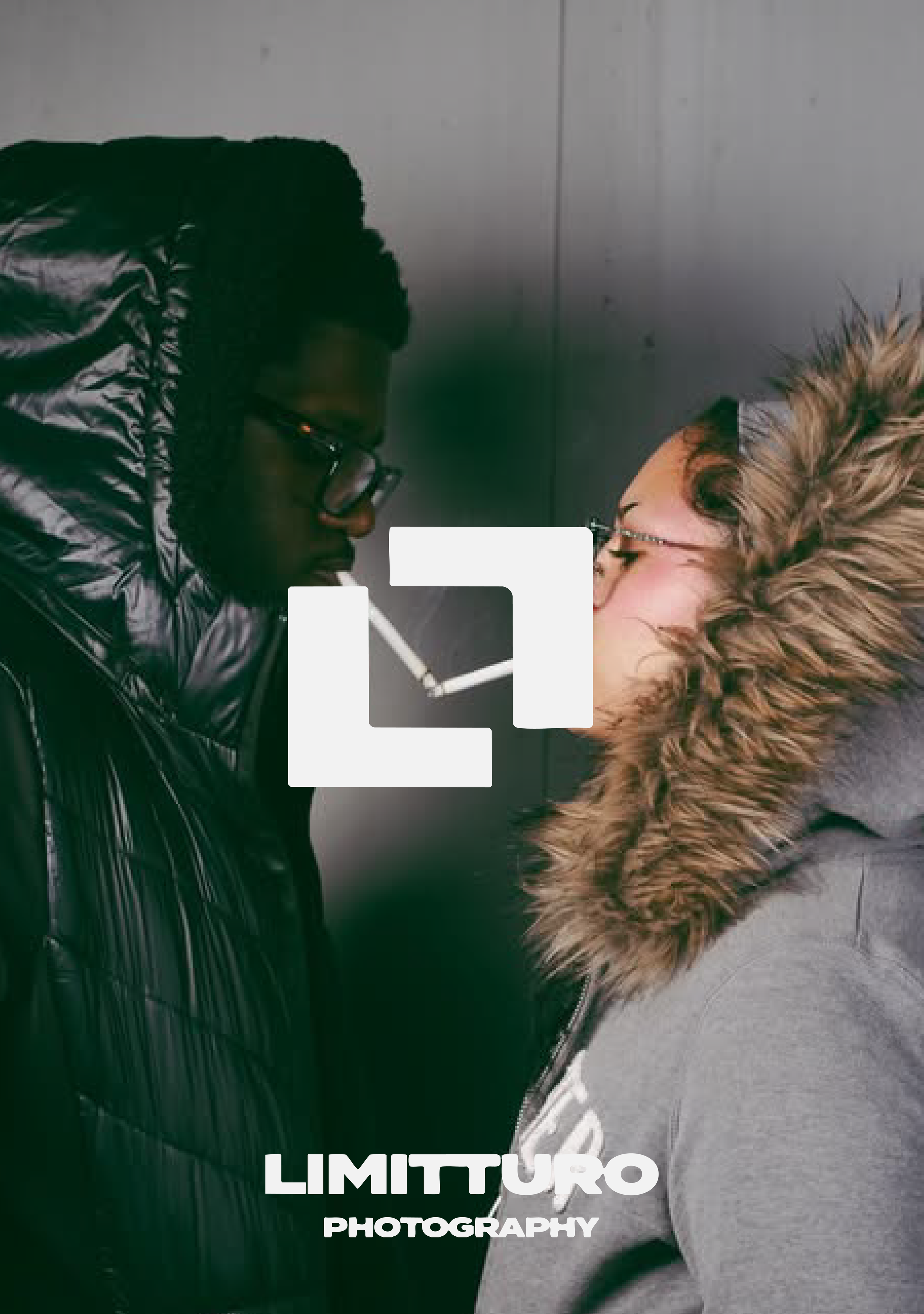 Two women face each other in close proximity, with one smoking a cigarette and the other looking at her. Both are wearing glasses and warm jackets, one with a shiny black puffer coat and the other with a gray coat with a fur-lined hood. The backgroun