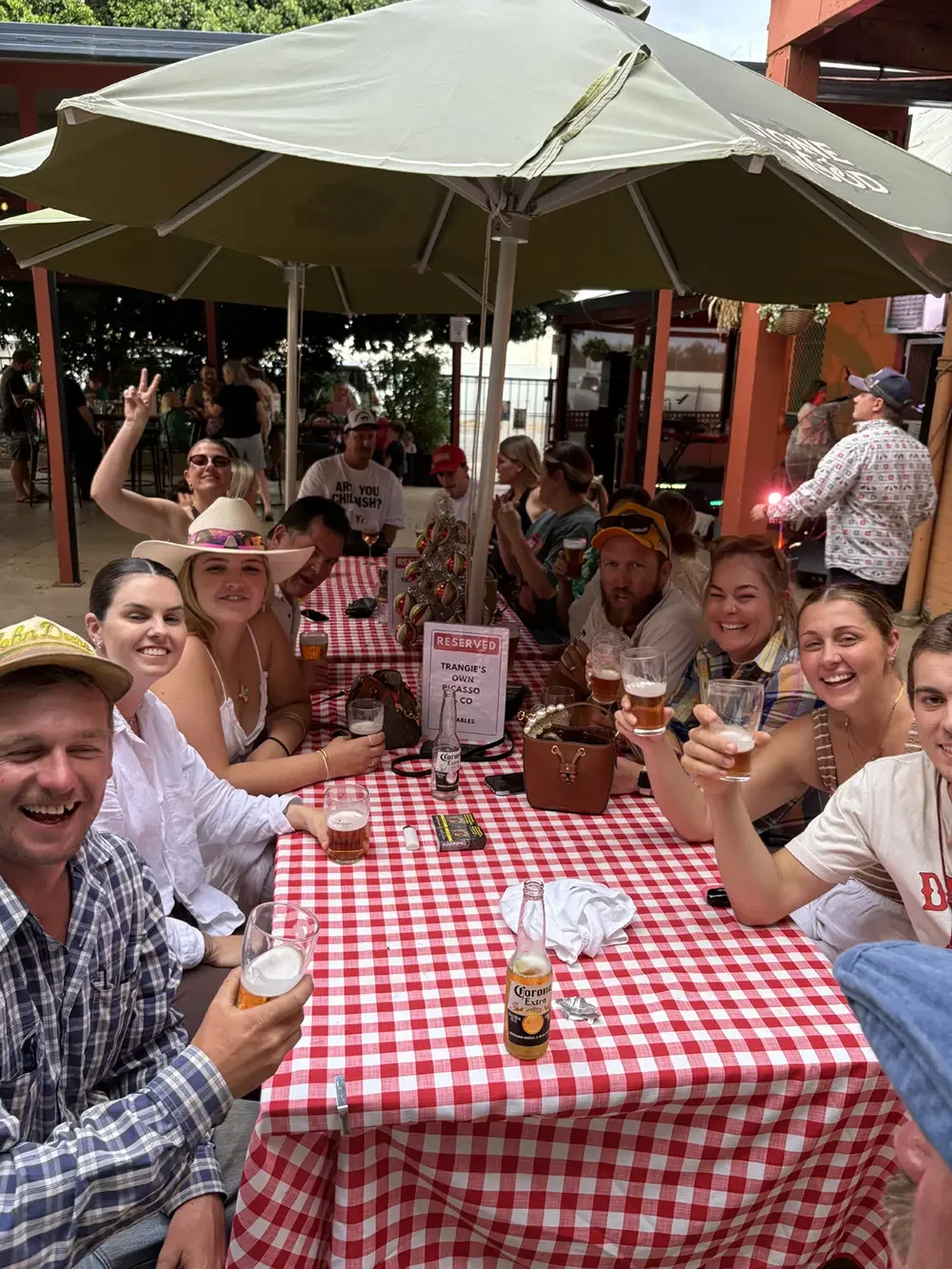 patrons sitting at a table in the beer garden and courtyard