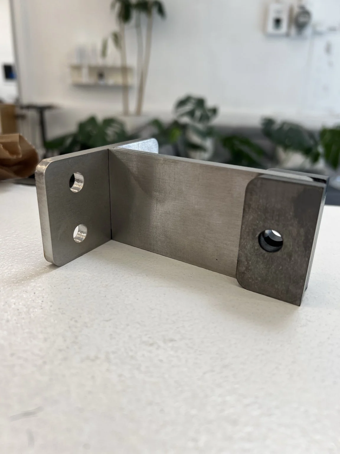Fabricated stainless steel railing connection showing the welded geometry and integrated mounting points developed specifically for The York waterfront project in Lake Oswego, Oregon.