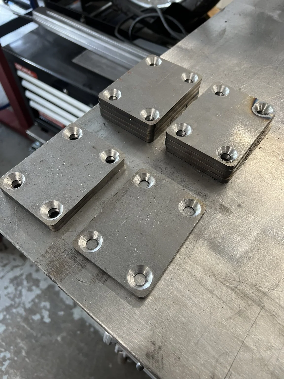 Custom-fabricated steel mounting plates and structural components for The York railing system, developed specifically for the architectural conditions of the Lake Oswego waterfront property.