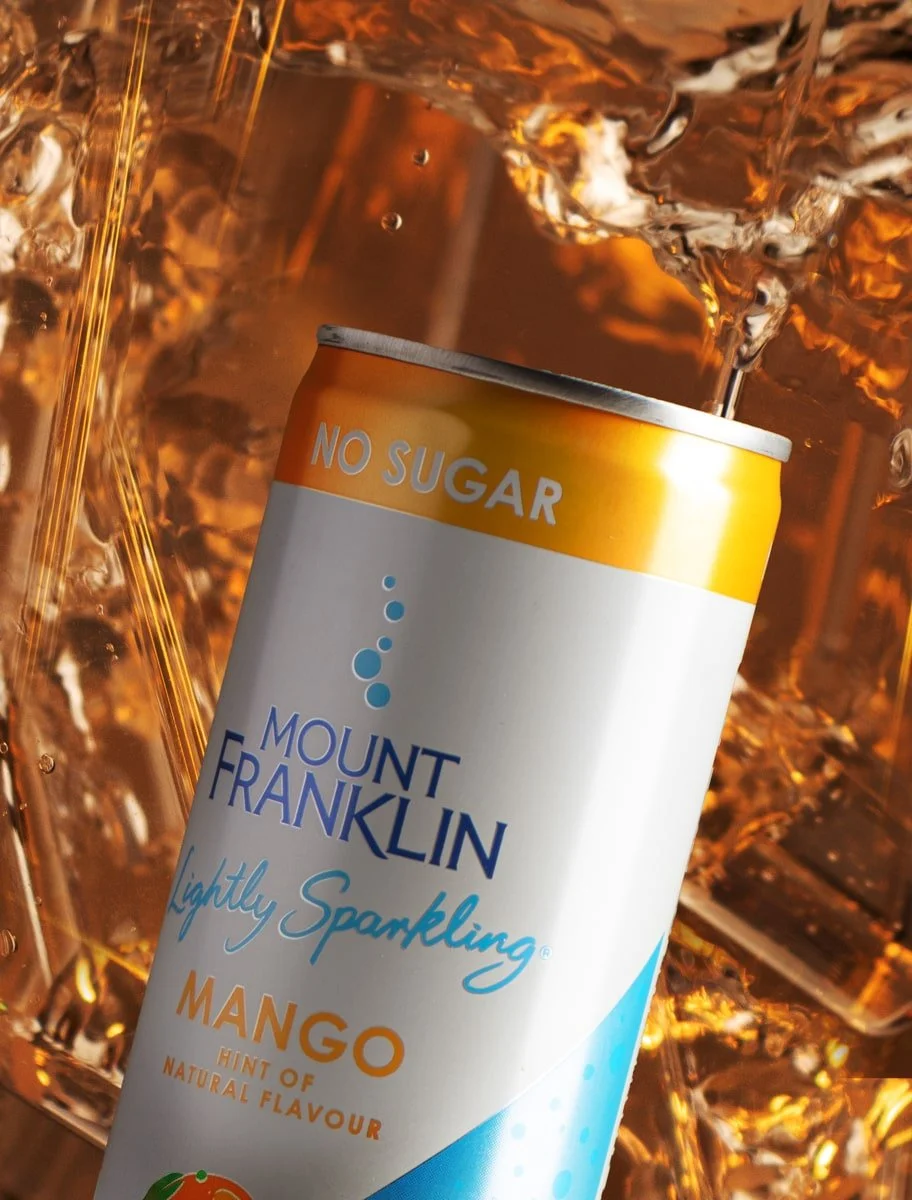 mango flavour can in water background