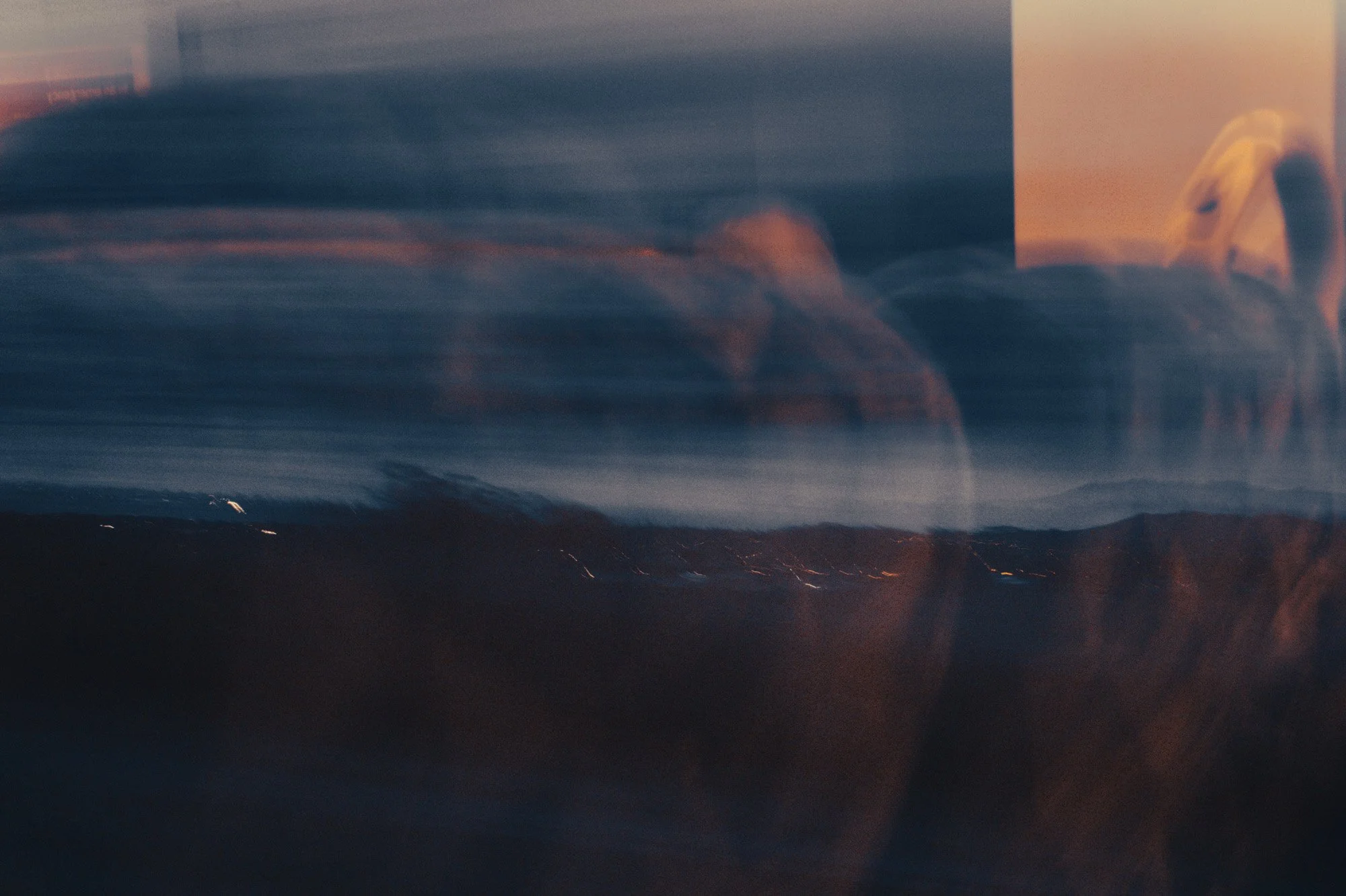 dark morning landscape, with train reflections