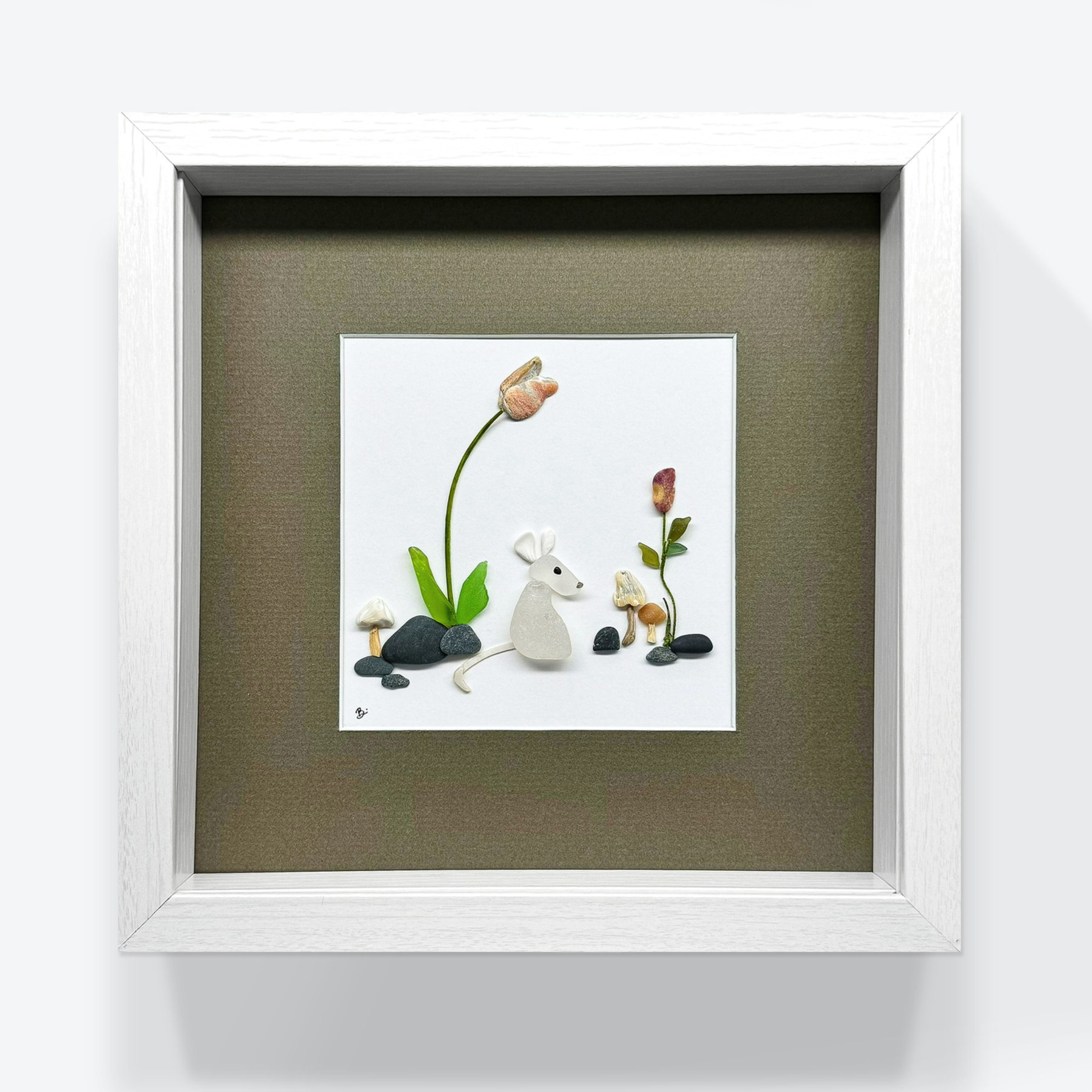 The finished white mouse garden, framed with a warm neutral mat that complements its natural materials.