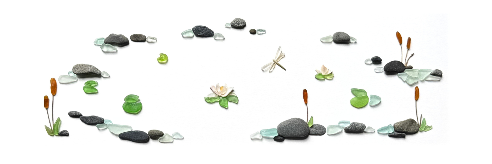 Whimsical sea glass meadow scene with tiny water lily flowers, cattails, dragonfly, and scattered stones on a white background.