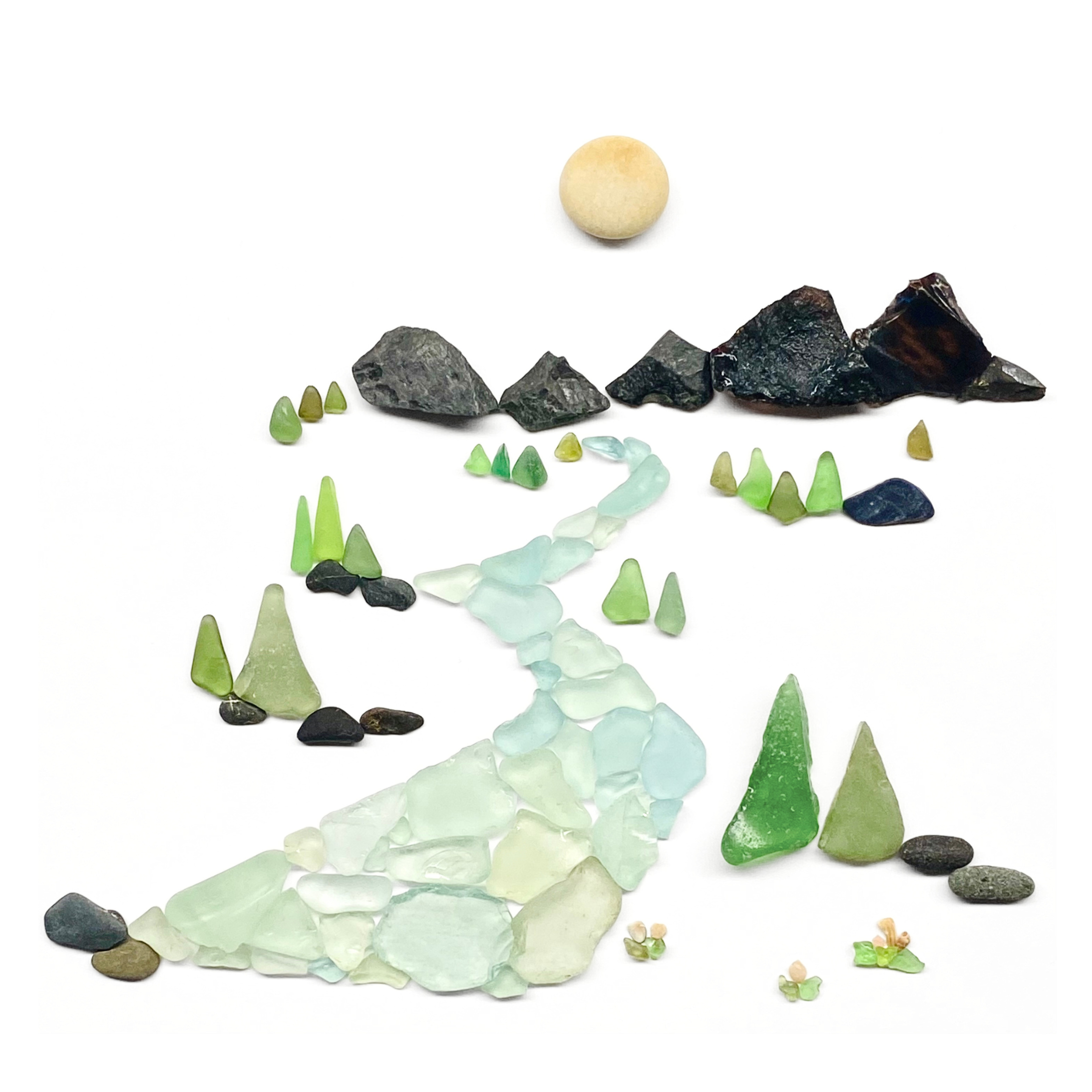A winding sea glass river flows from dark mountain peaks through a forest of tiny evergreen trees.