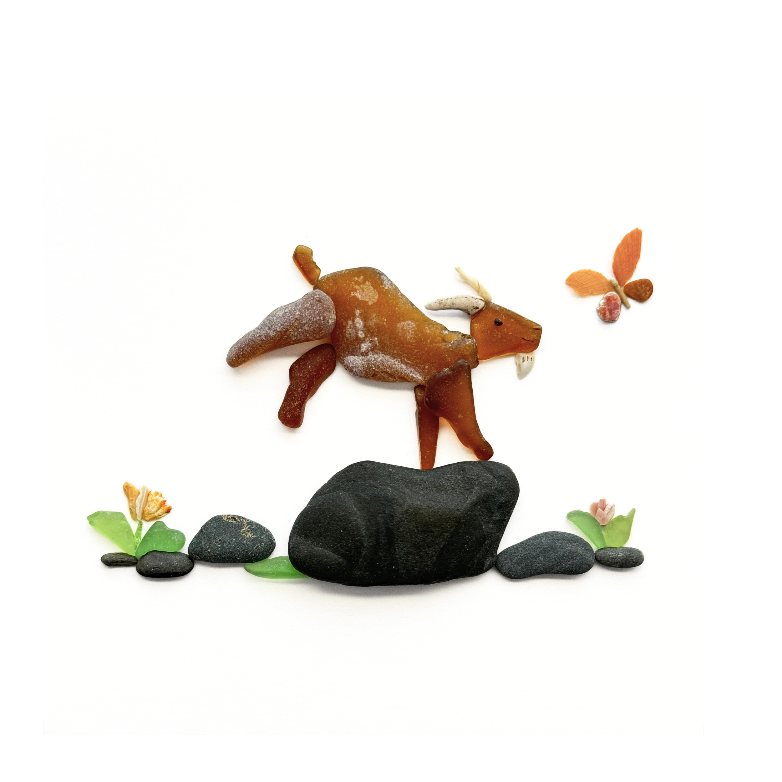 A playful sea glass goat kicks up its hind legs as an orange butterfly flutters nearby.