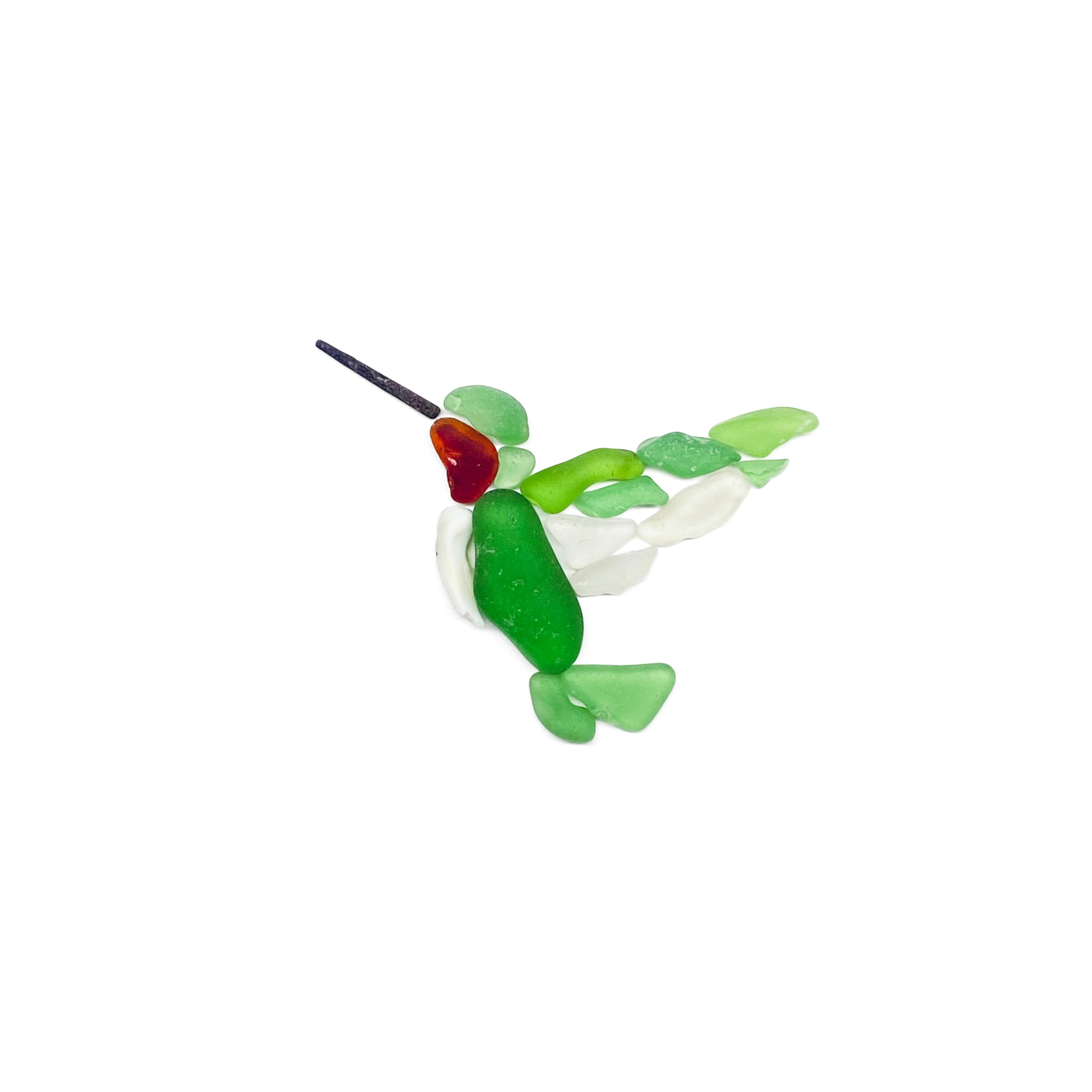 A vibrant sea glass ruby throated hummingbird hovers in flight, its layered wings and tail capturing a sense of movement.
