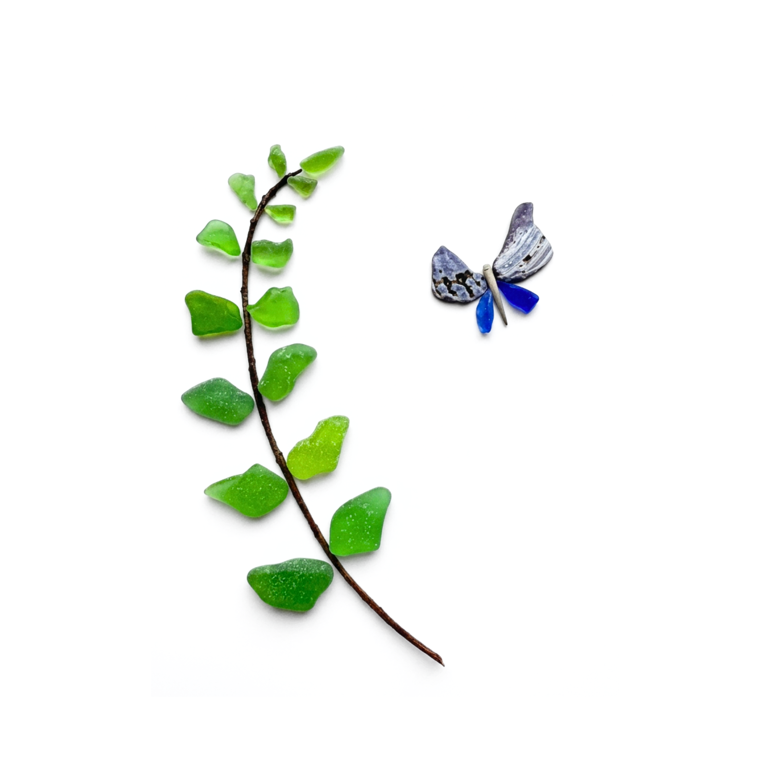 Green sea glass fern branch with a blue butterfly on a white background.
