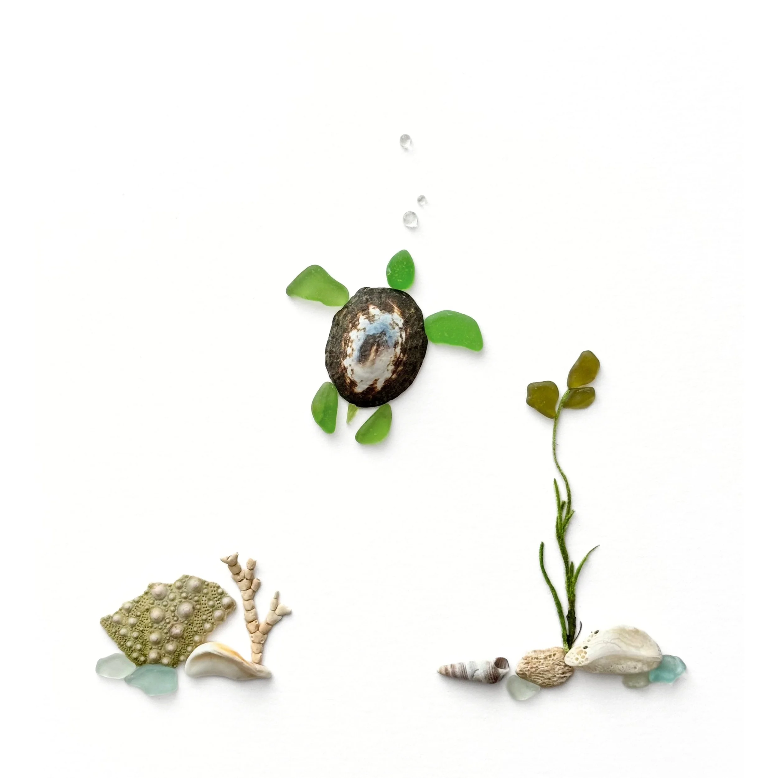 Original sea glass artwork featuring a swimming sea turtle with green sea glass flippers and a patterned shell, floating bubbles, seaweed, and seashell treasures along the ocean floor.