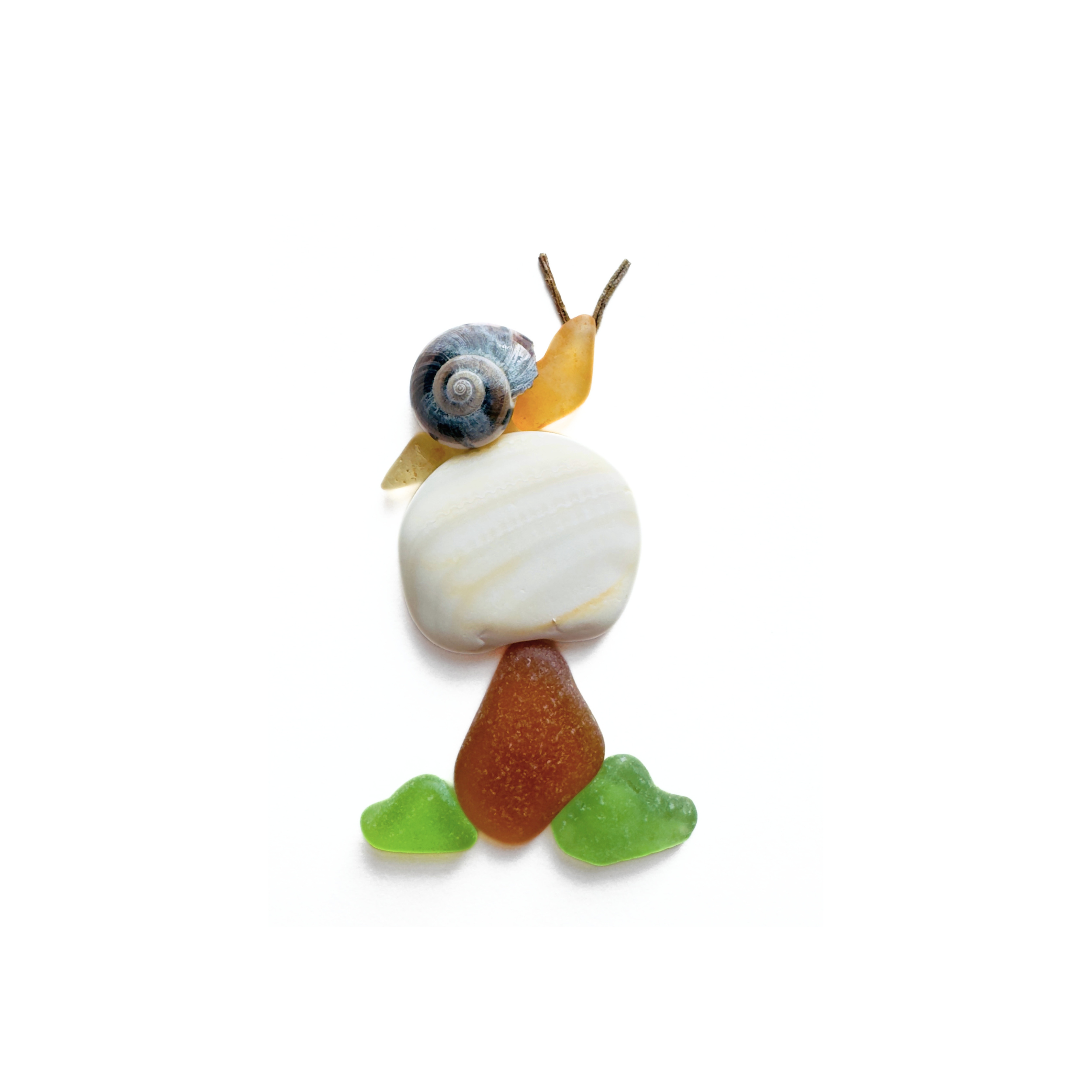 A whimsical snail rests atop a mushroom created from sea glass, stone, and coastal finds.
