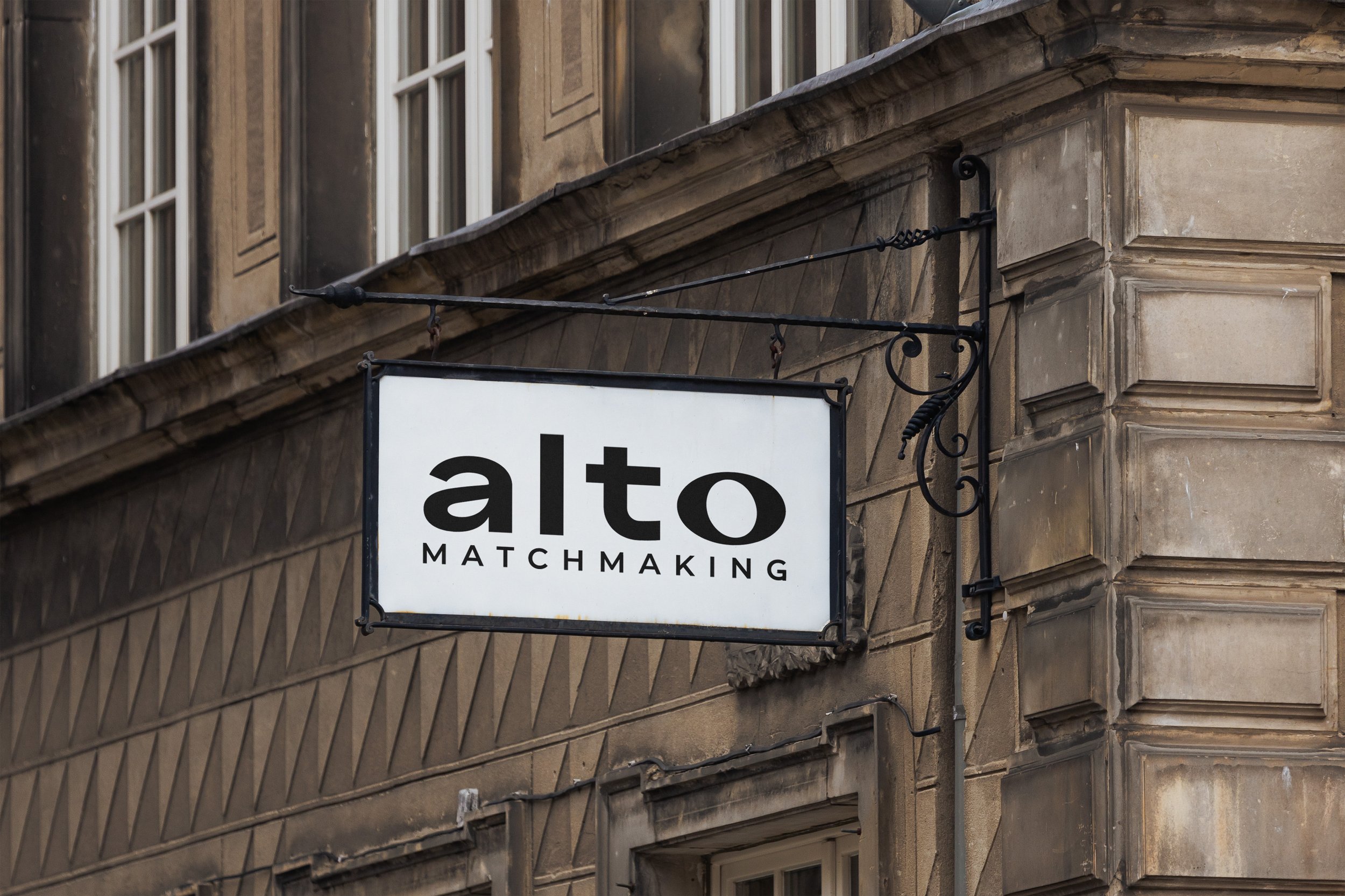 The Alto Matchmaking sign hanging in front of a European building facade.