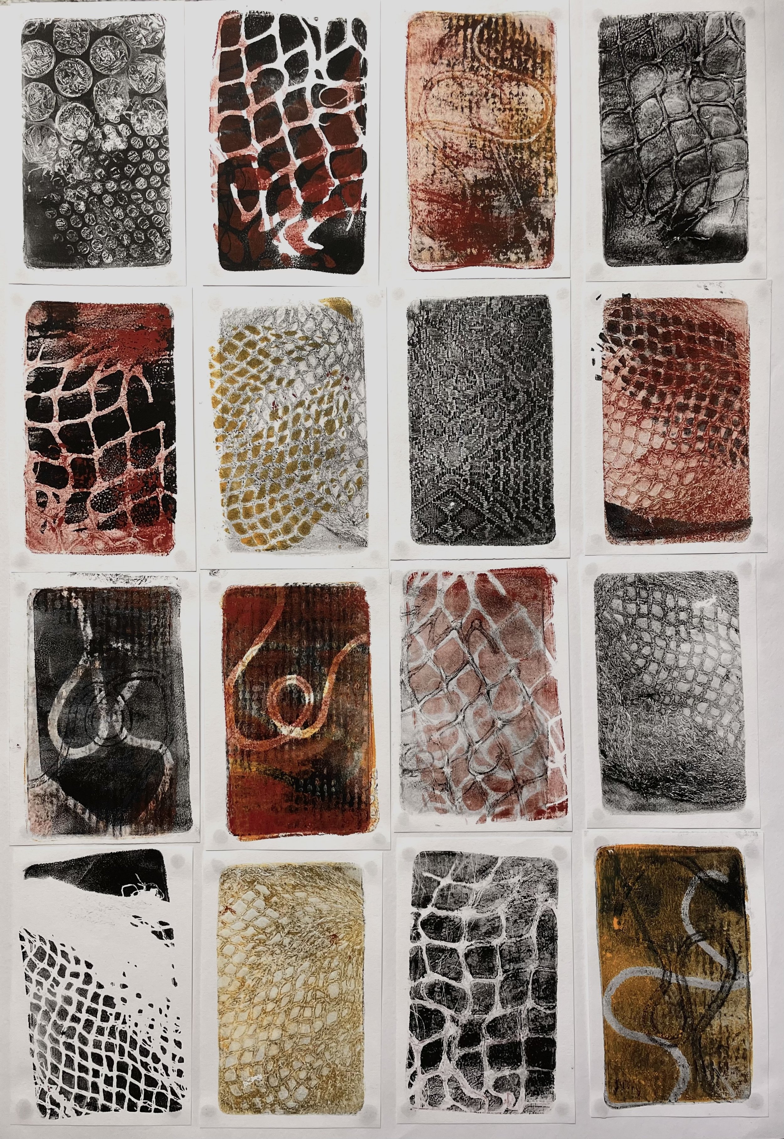 Art prints featuring abstract patterns, textures, and grids in black, red, and earthy tones arranged in a grid format.