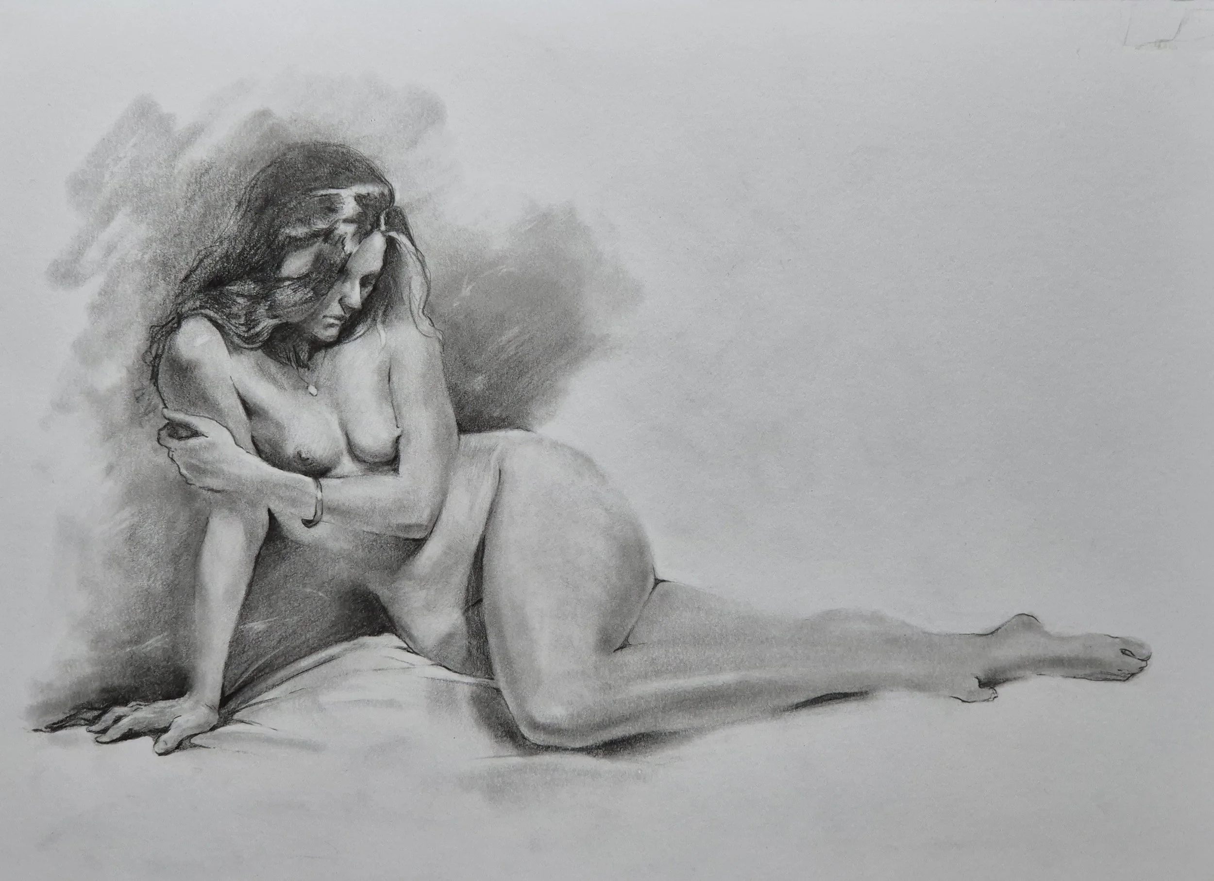 A black and white pencil sketch of a woman sitting on a surface, with one arm supporting her and her head resting on her hand, appearing contemplative. She has long, flowing hair and is partially nude, with her legs extended and bare feet visible.