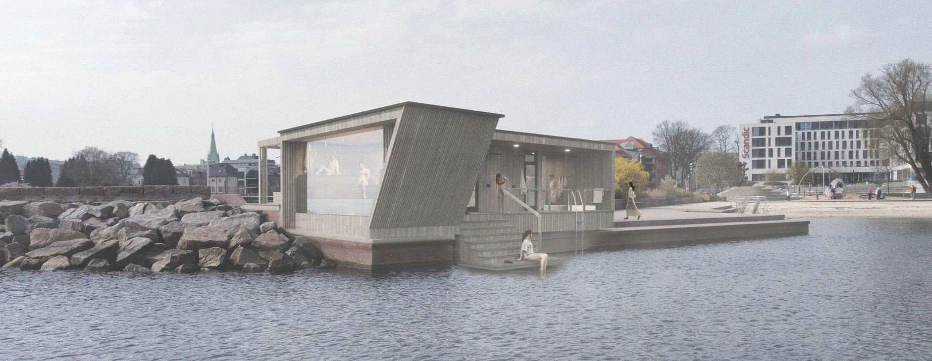 A modern building on a waterfront with stairs leading into the water, surrounded by rocks and trees, in an urban area with a park and multi-story buildings in the background.