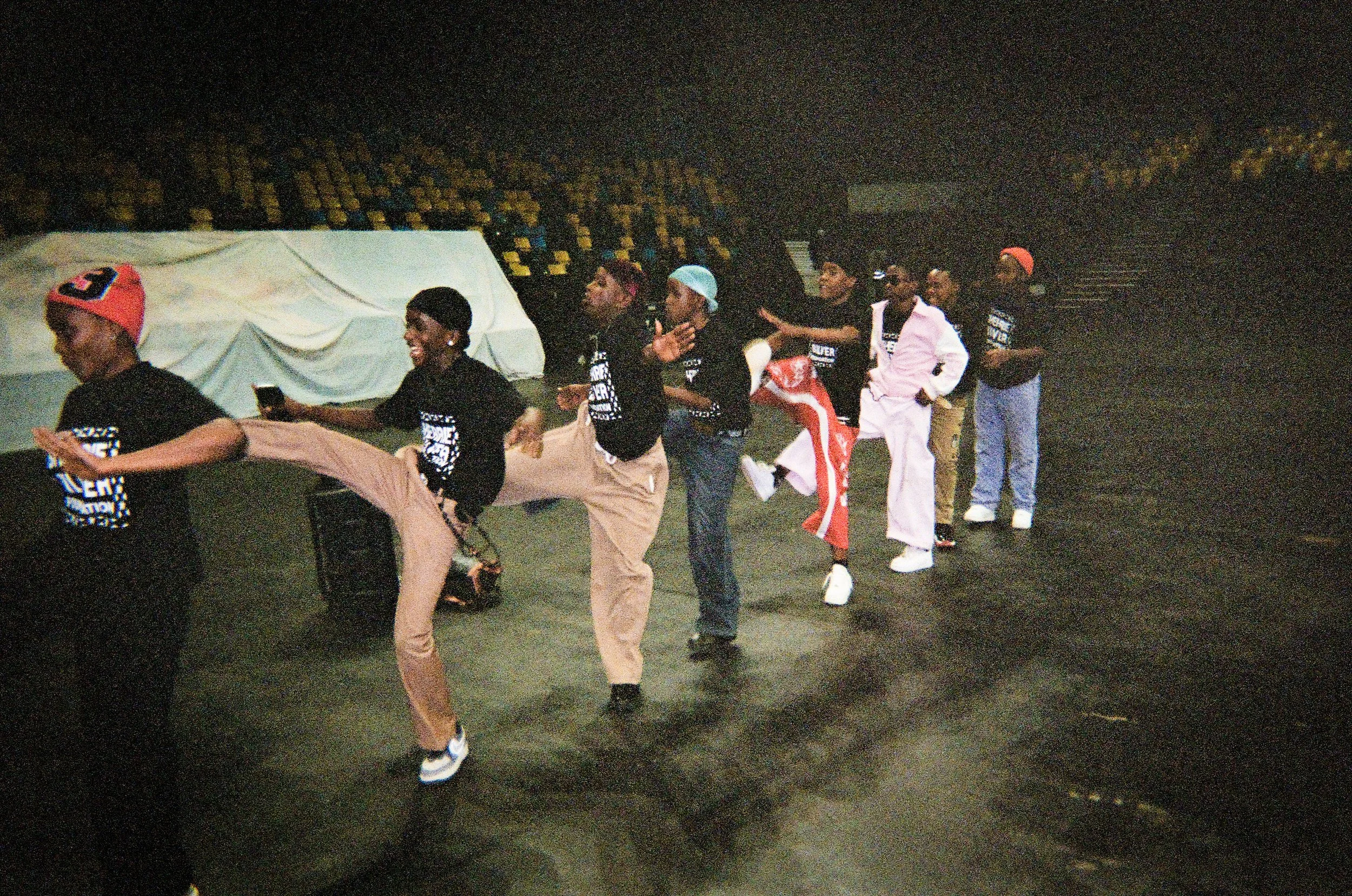 Young performers gather between activities at a Sherrie Silver Foundation session in Kigali, Rwanda. The organization gives emerging dancers and singers access to mentorship, training, and industry opportunities. Image: Jordan Hidalgo 