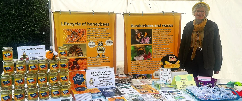 Our stall at a local show, with jars of honey and posters about the life cycle of bees