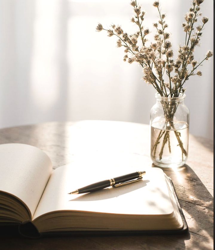 Notebook and pen on a desk symbolizing learning sociology and thinking critically about modern society