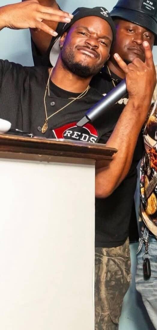 DJ Trill on stage with a Microphone